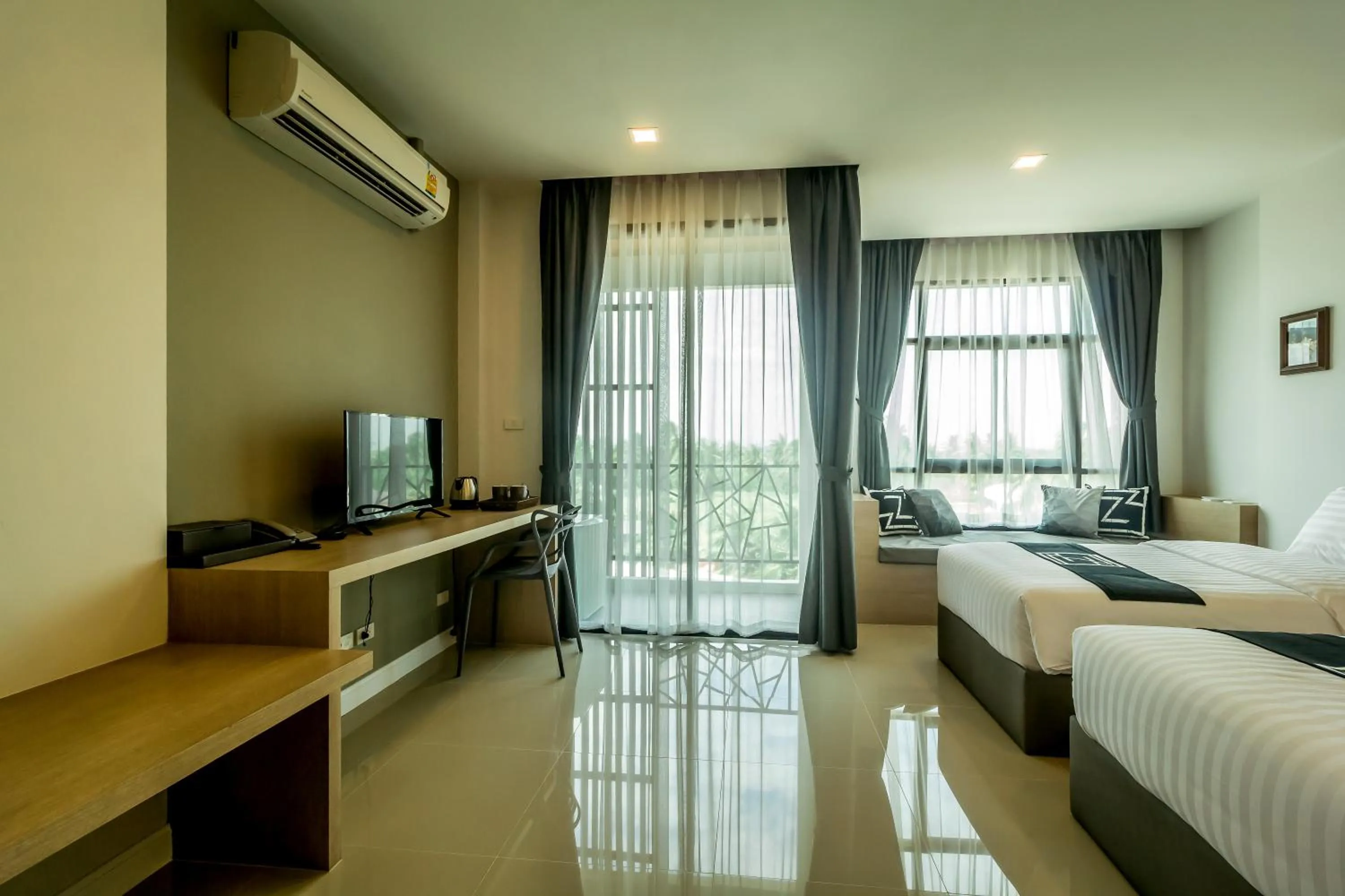 Bed in Triple Z Hotel