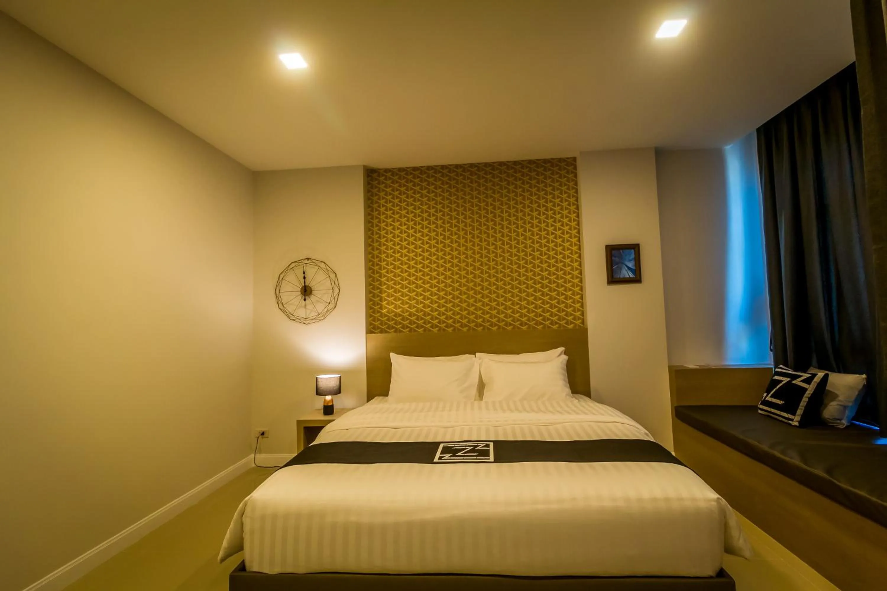 Bed in Triple Z Hotel