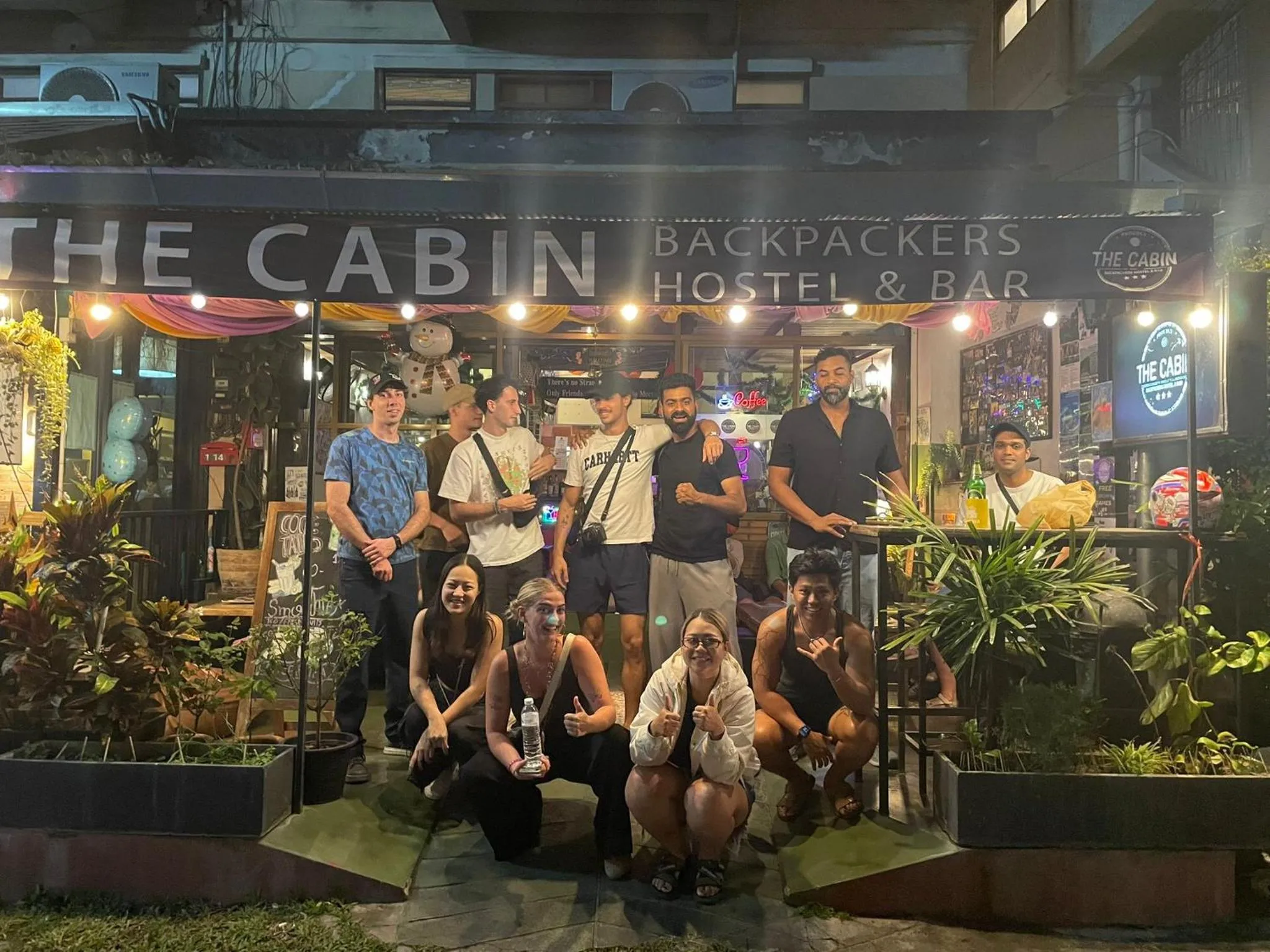 group of guests in The Cabin Backpackers Hostel & Bar