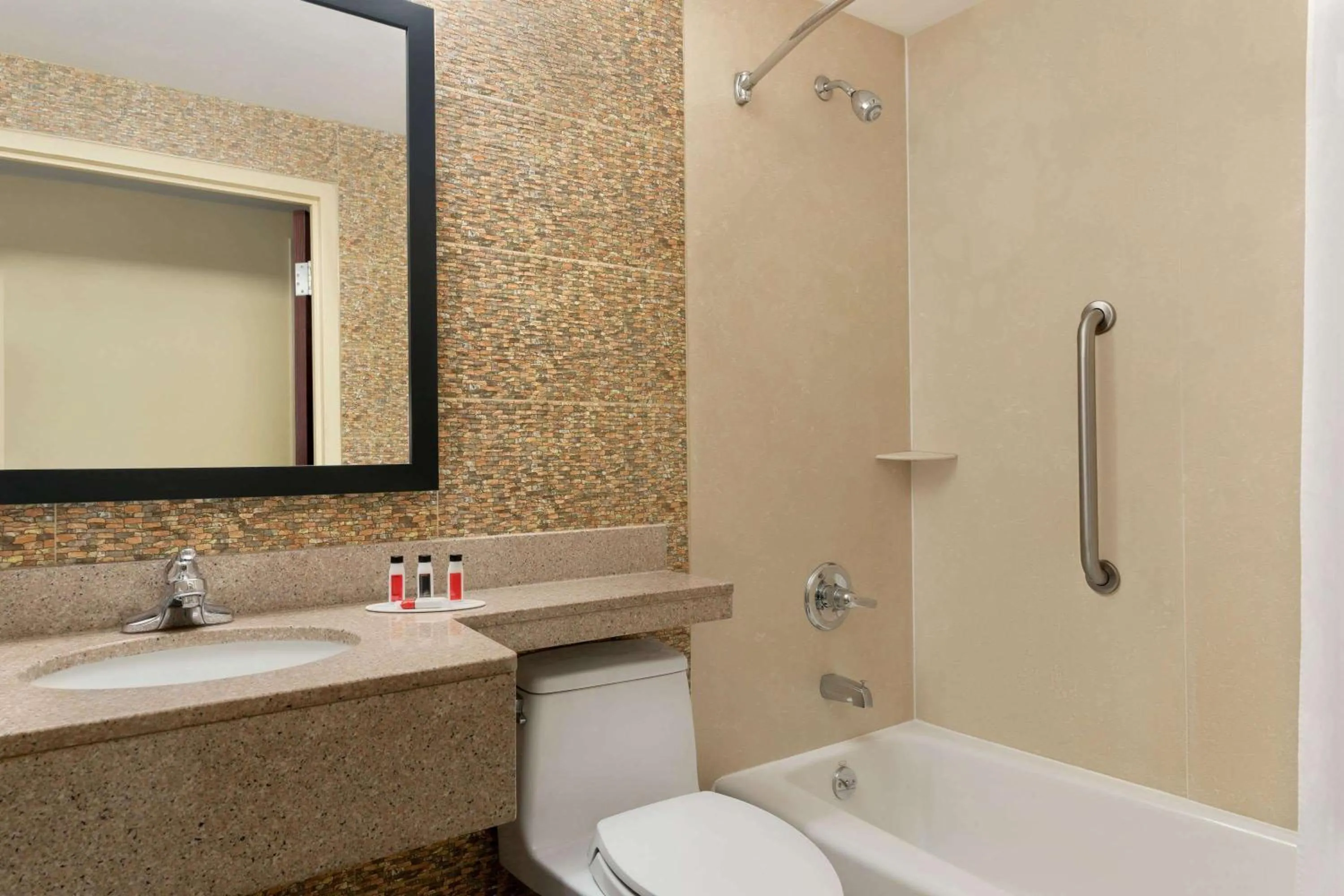 Bathroom in Days Inn by Wyndham Brooklyn