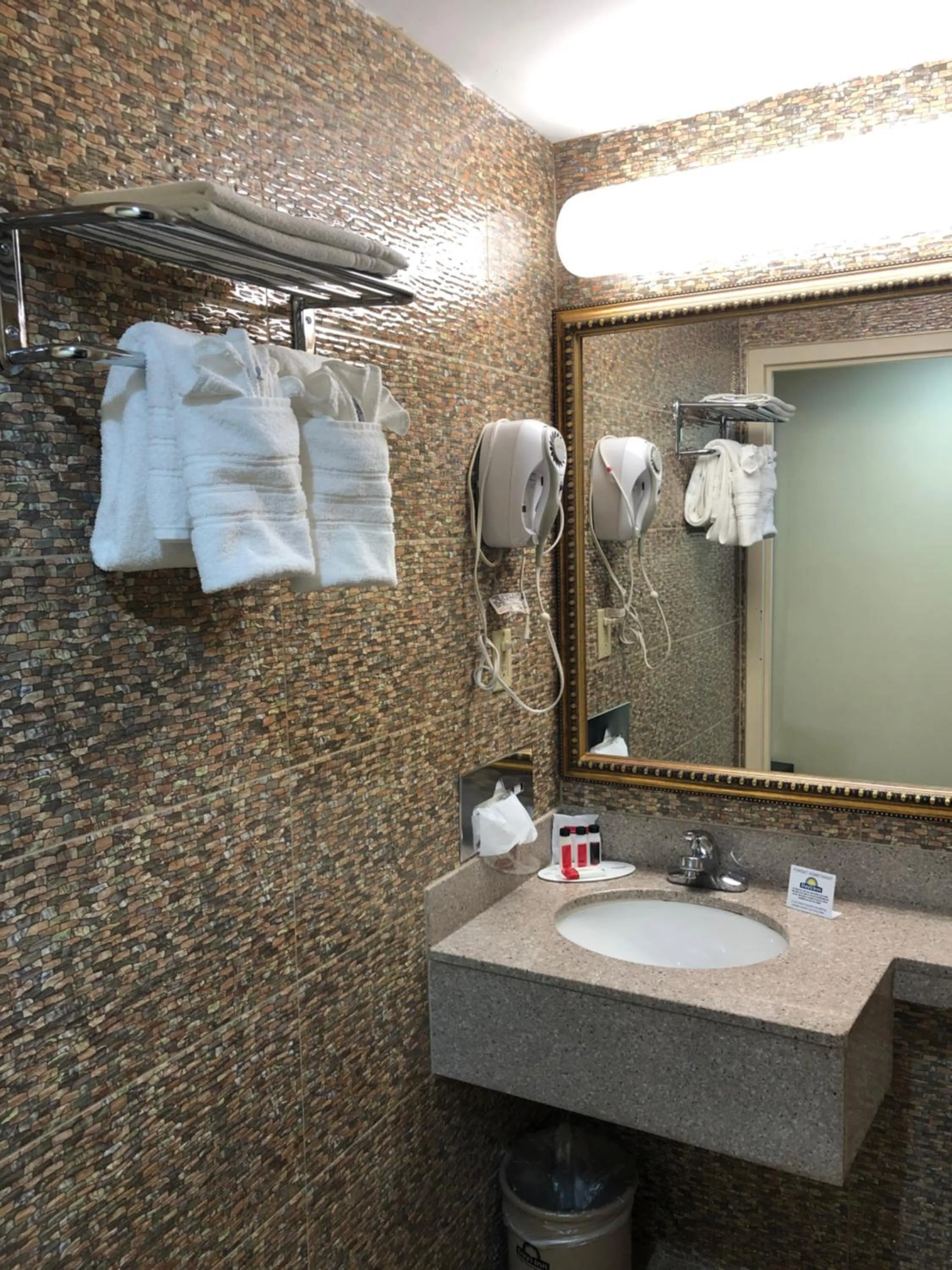 Bathroom in Days Inn by Wyndham Brooklyn