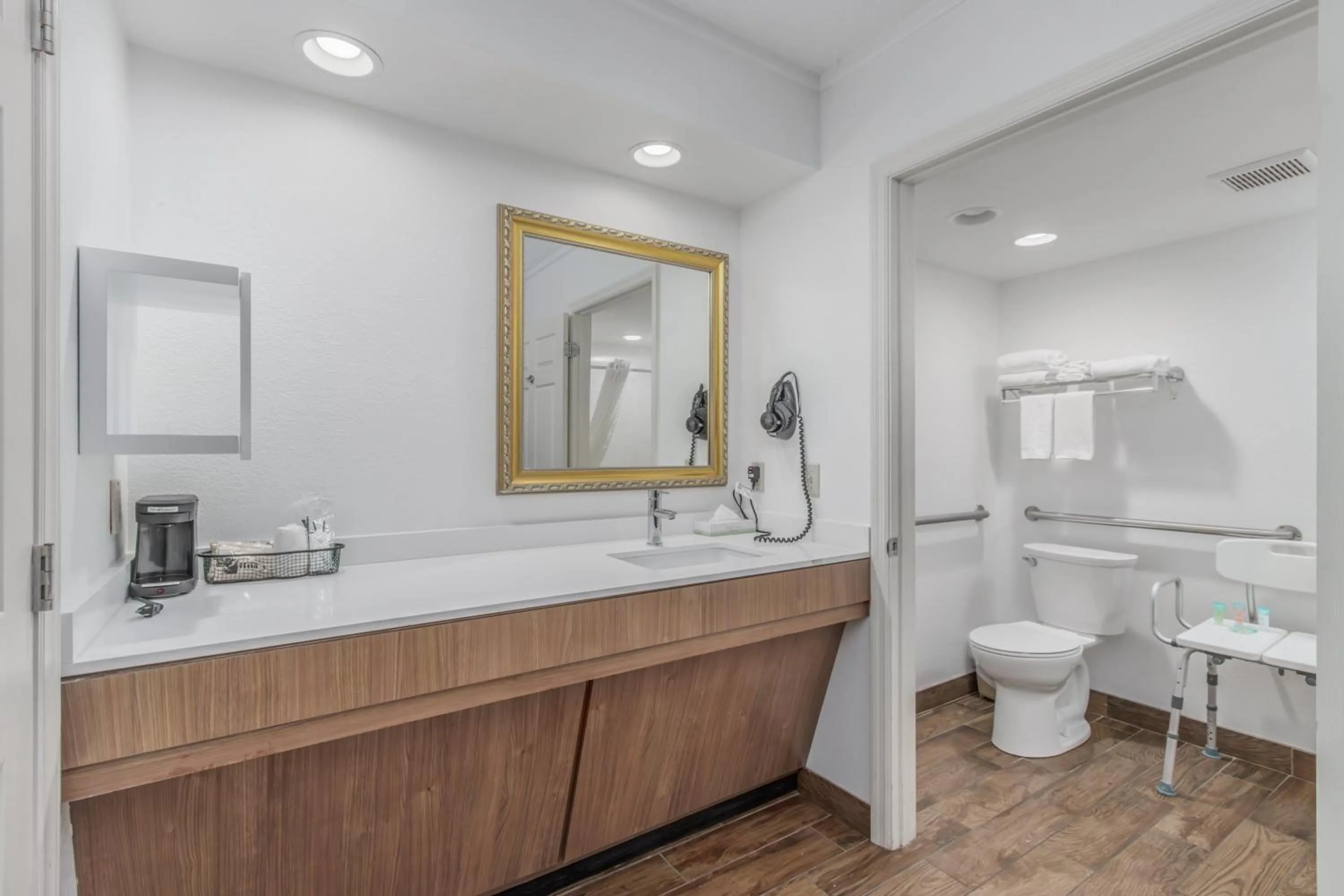 Toilet in Crossroads Inn & Suites