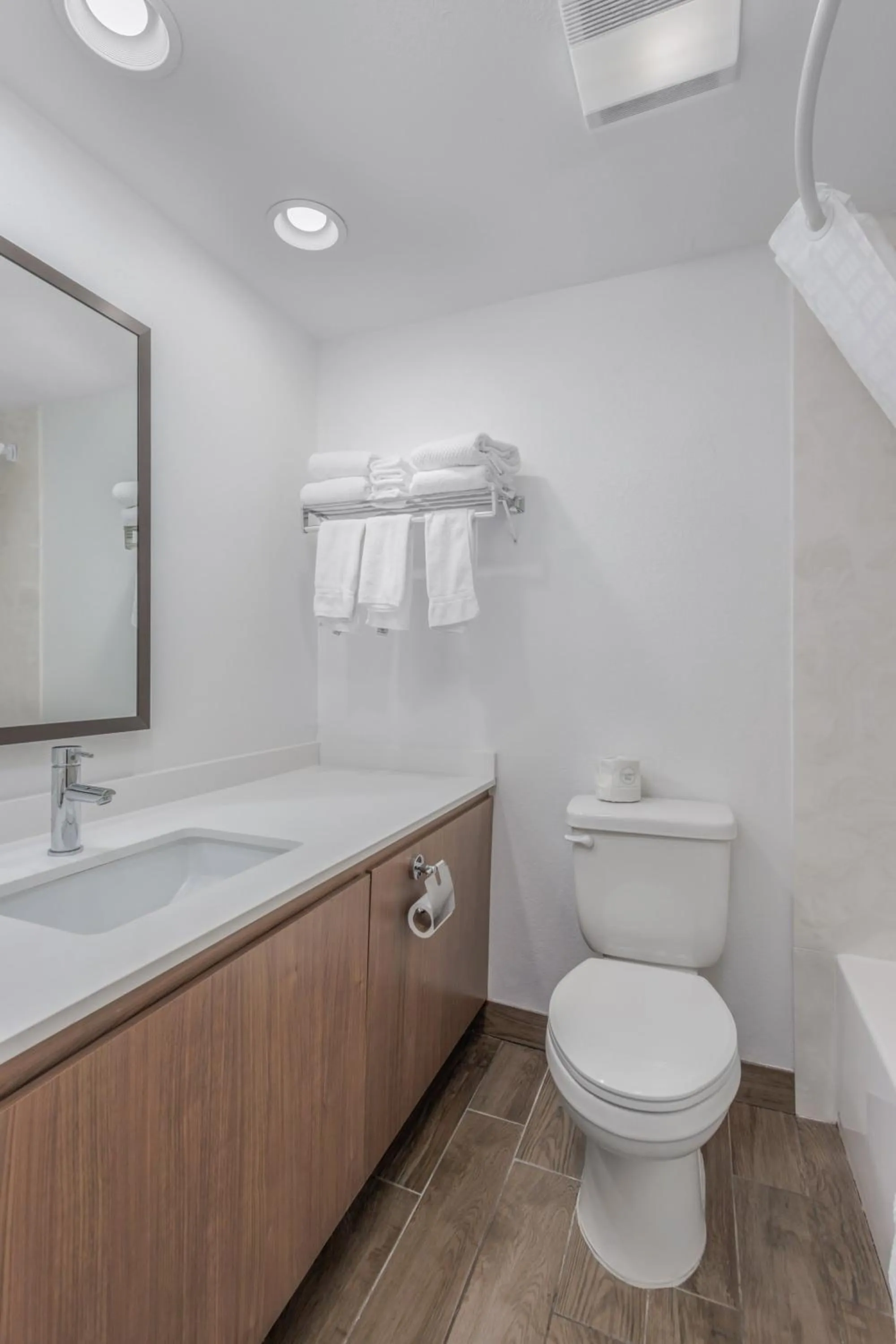 Toilet in Crossroads Inn & Suites