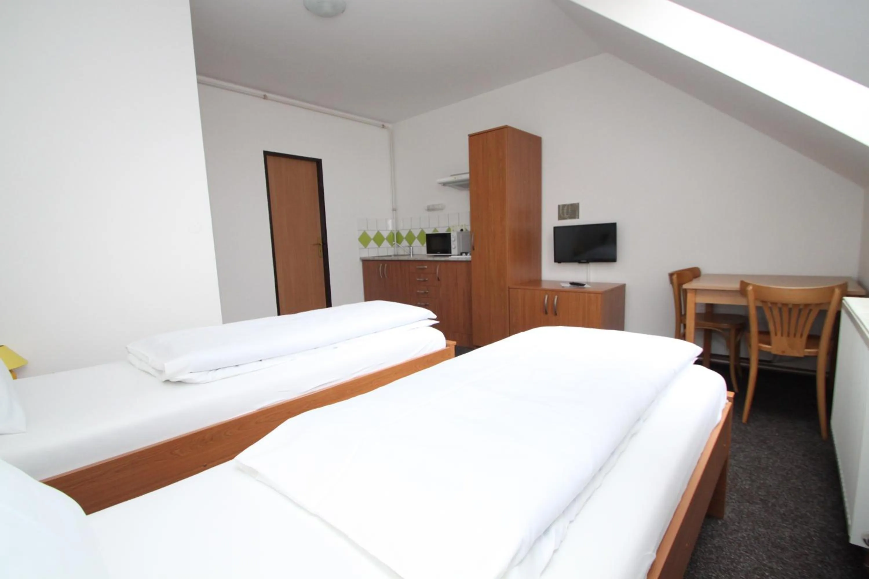 Kitchen or kitchenette, Bed in Penzion U Gigantu