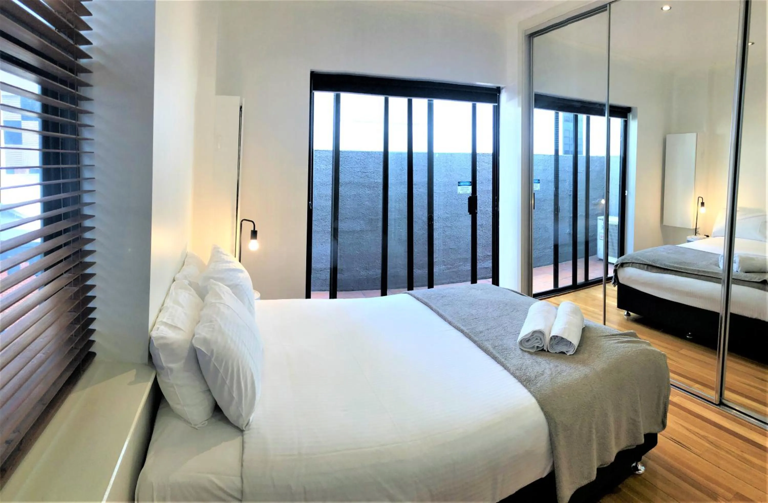 Bedroom, Bed in ReadySet Apartments on King