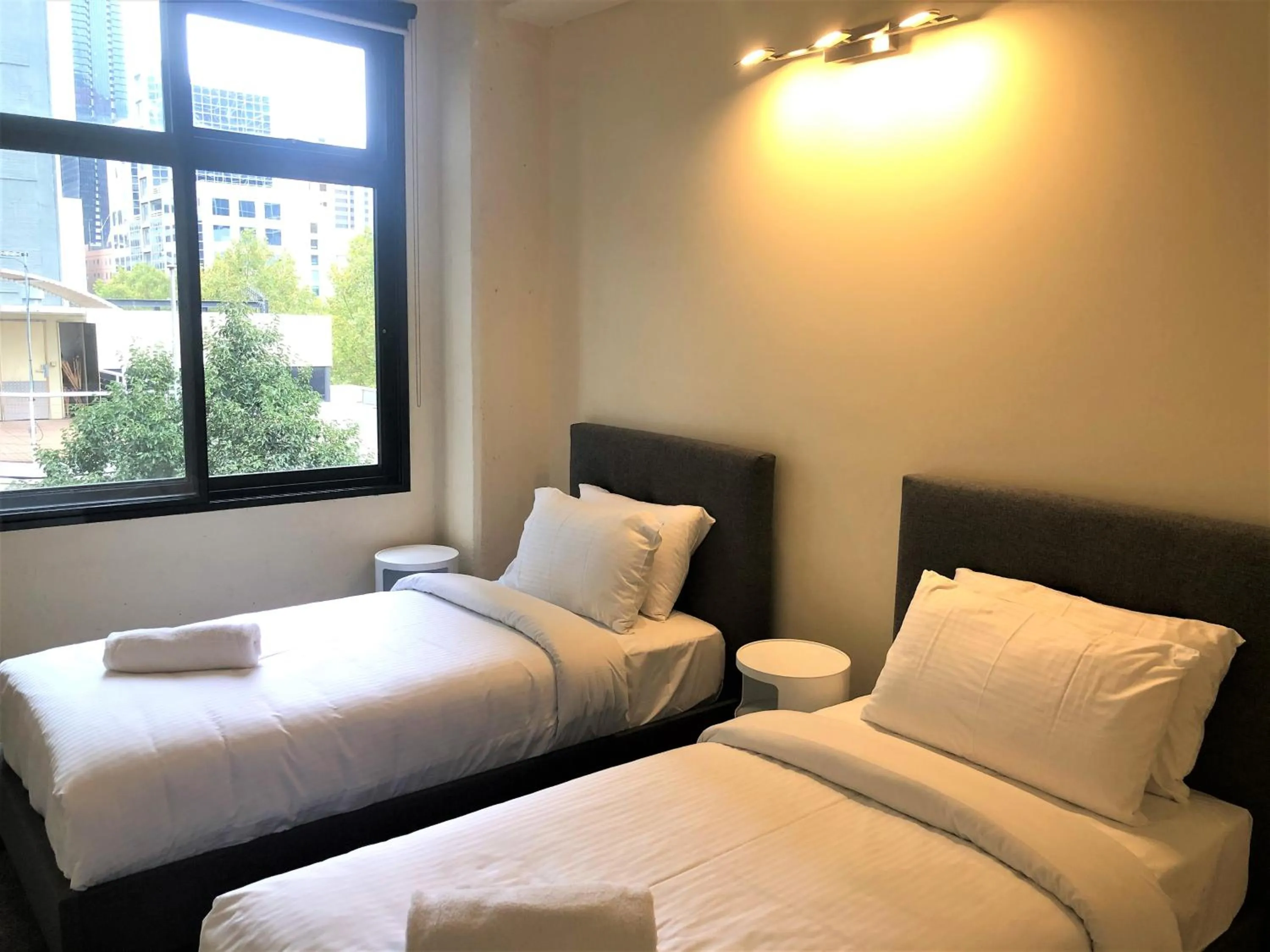 Bed in ReadySet Apartments on King