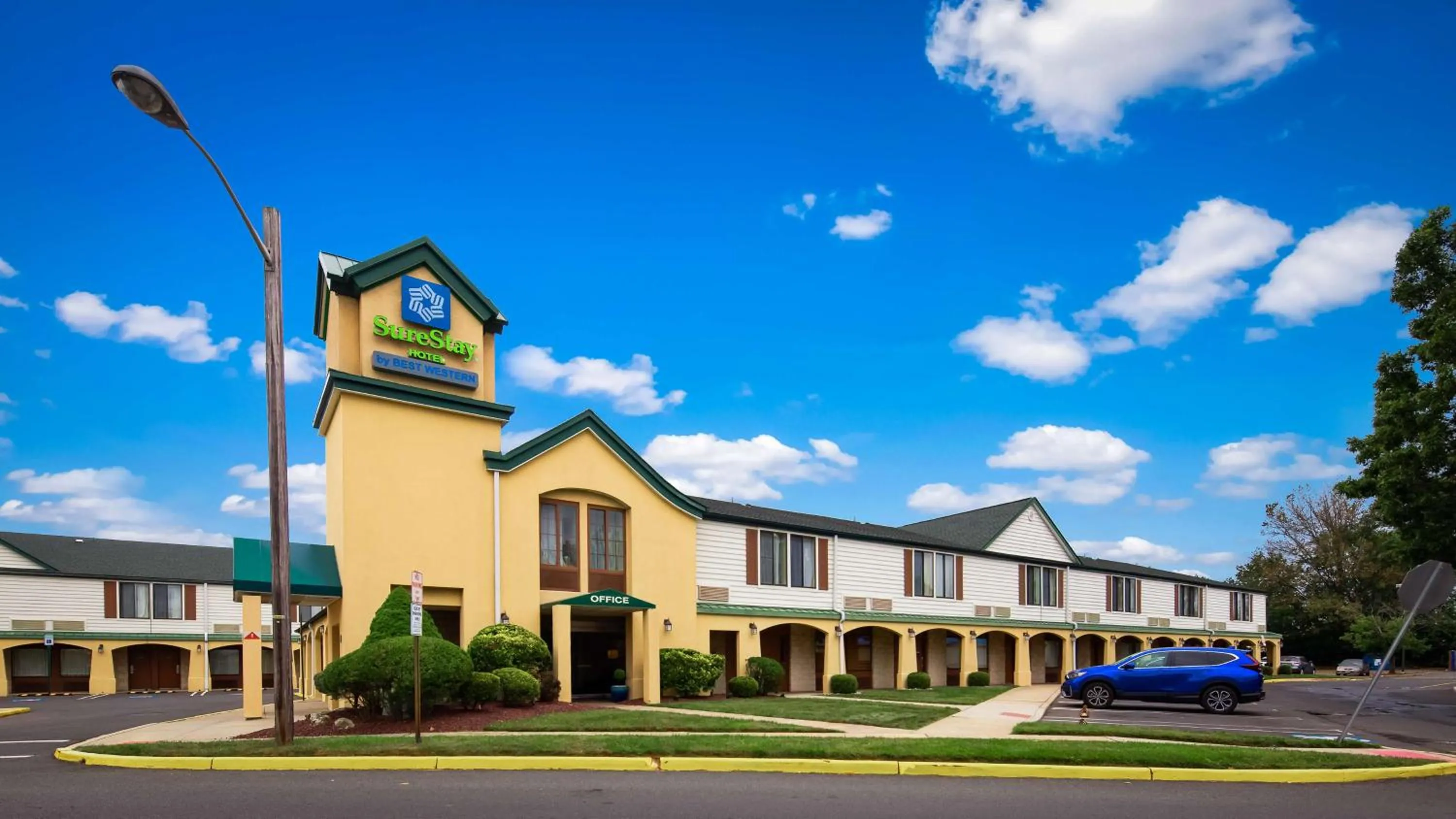 Property building in SureStay Hotel by Best Western East Brunswick