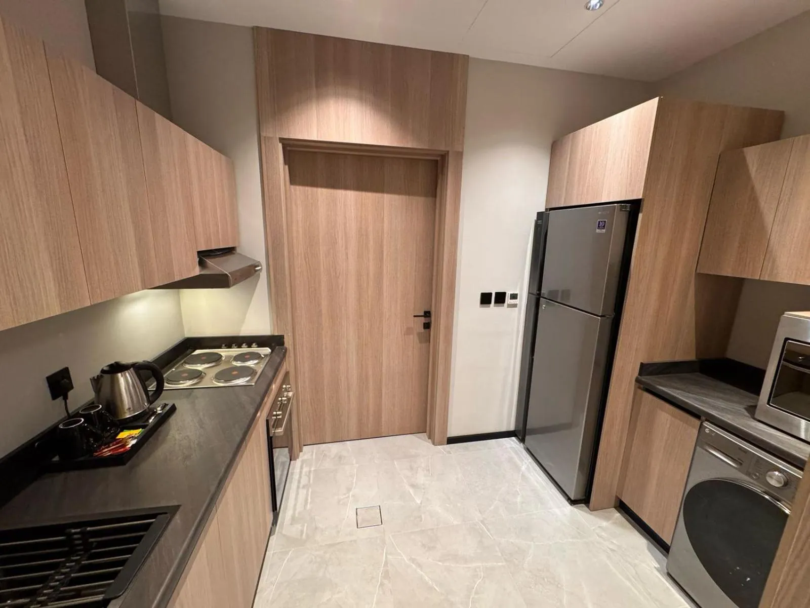 kitchen in Manazel Aldiafah serviced Apartments AlSulymaniyah