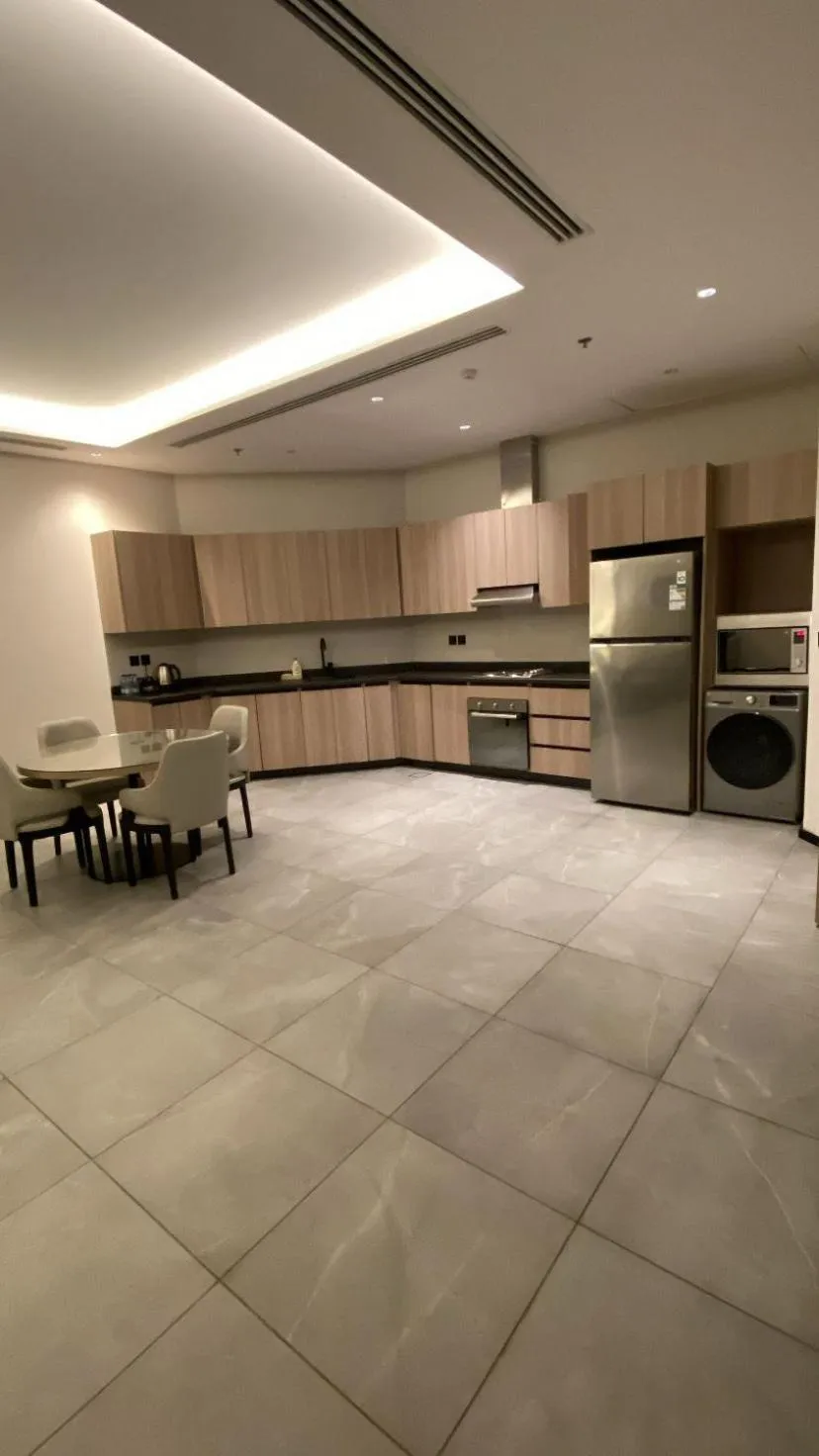 kitchen in Manazel Aldiafah serviced Apartments AlSulymaniyah