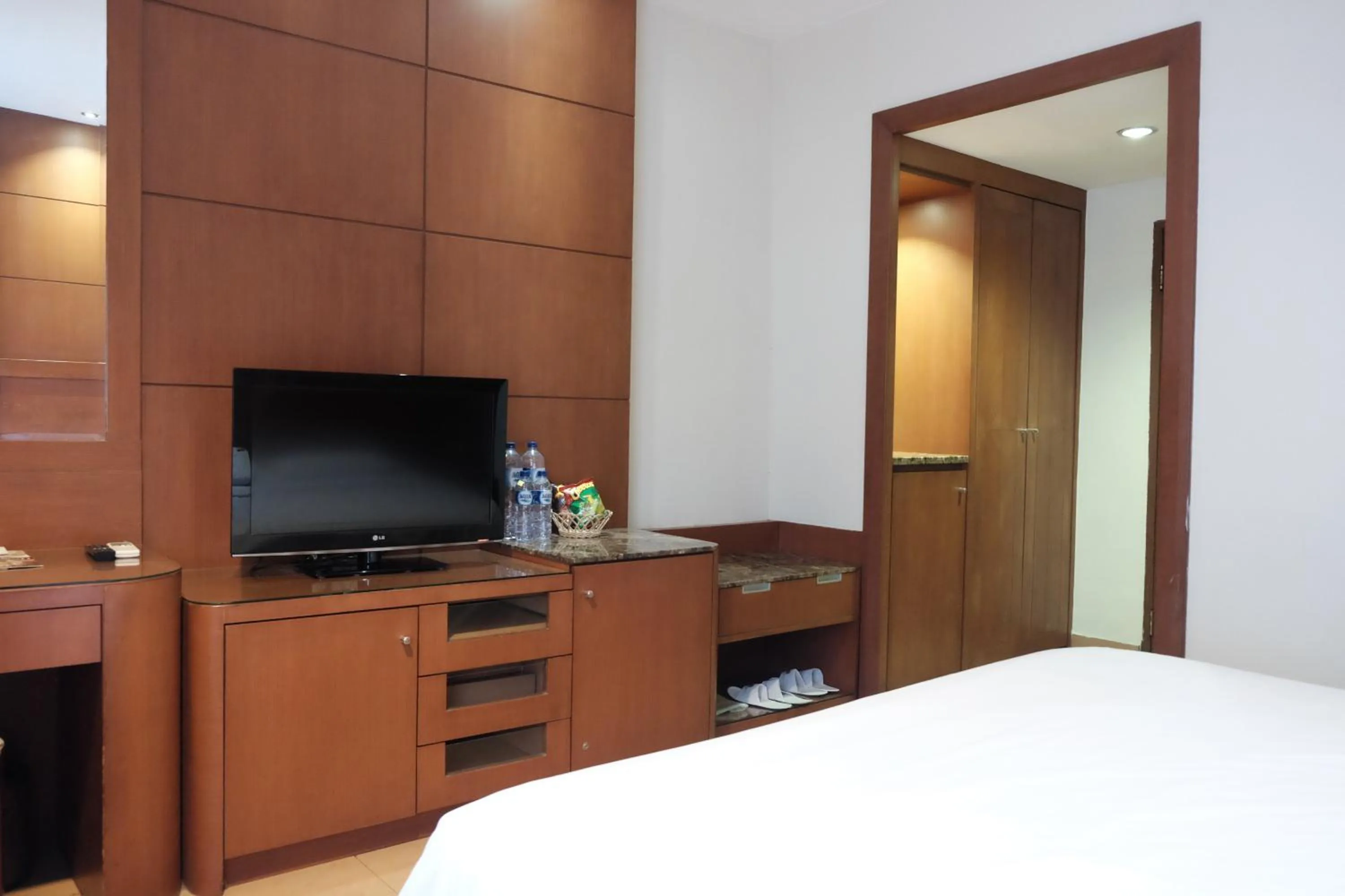 Bed in Grand Sakura Hotel