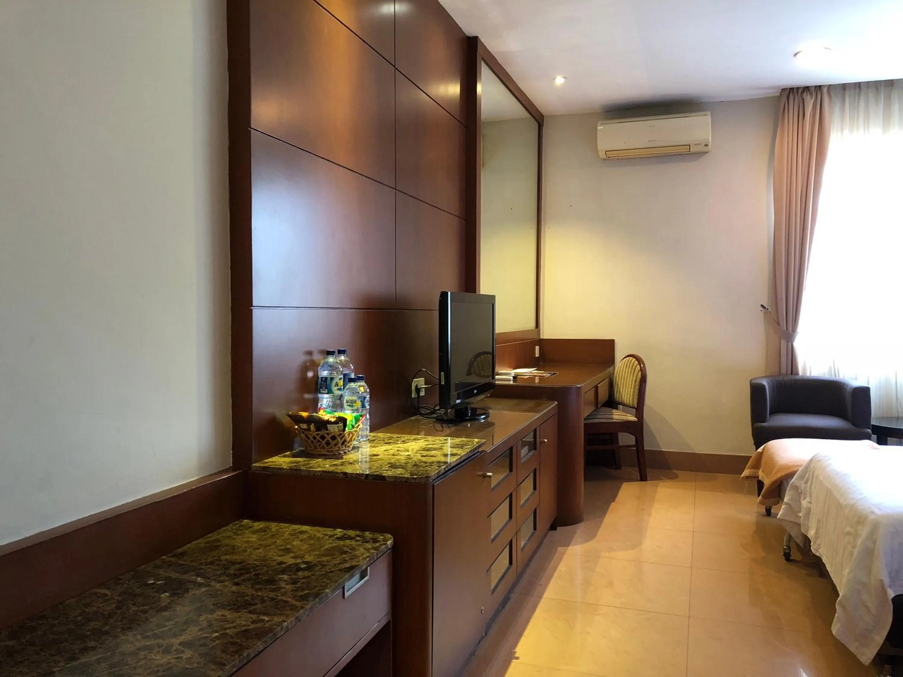 Bed in Grand Sakura Hotel