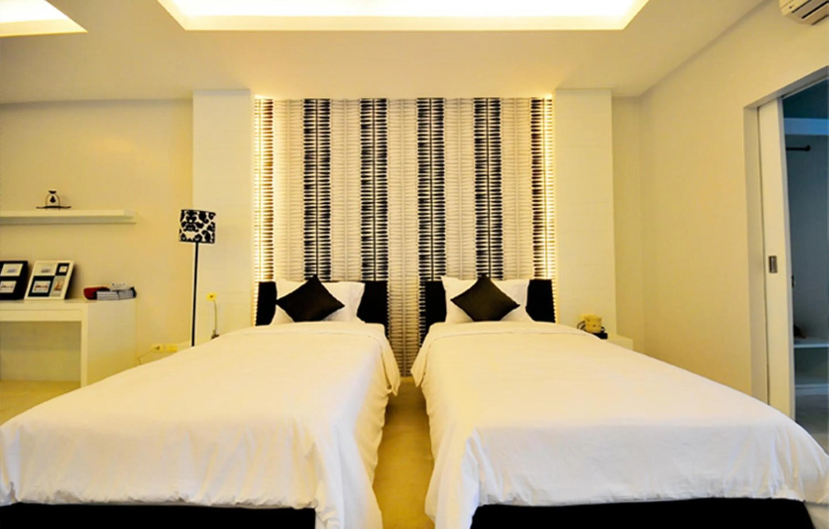 Bed in Surintra Boutique Resort