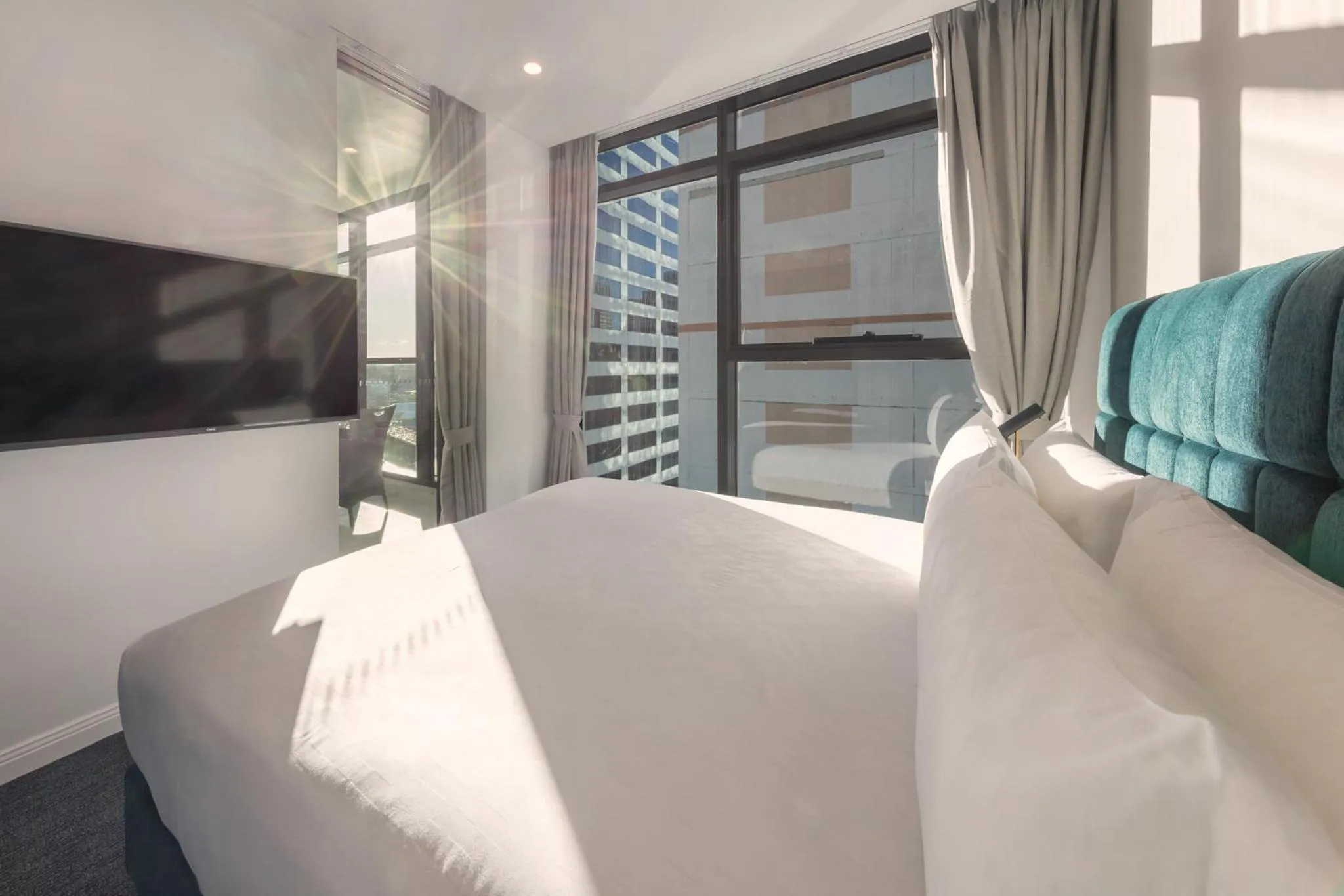 Bed in Meriton Suites Sussex Street, Sydney