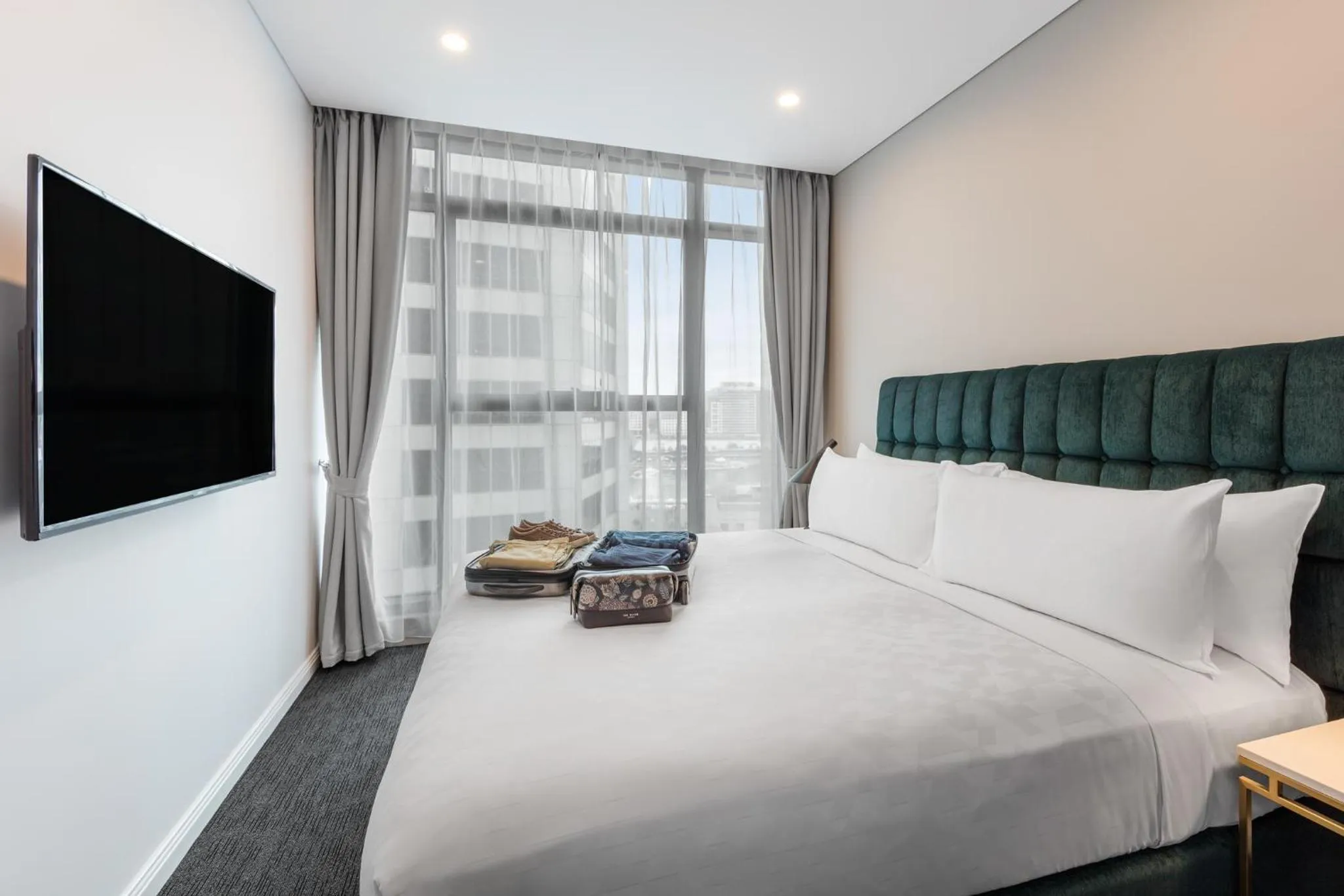 Bed in Meriton Suites Sussex Street, Sydney