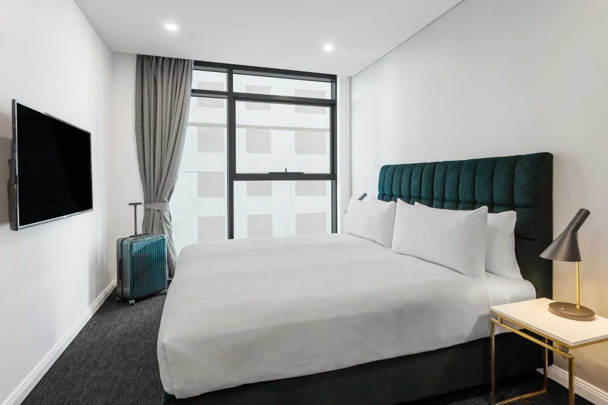 Bed in Meriton Suites Sussex Street, Sydney