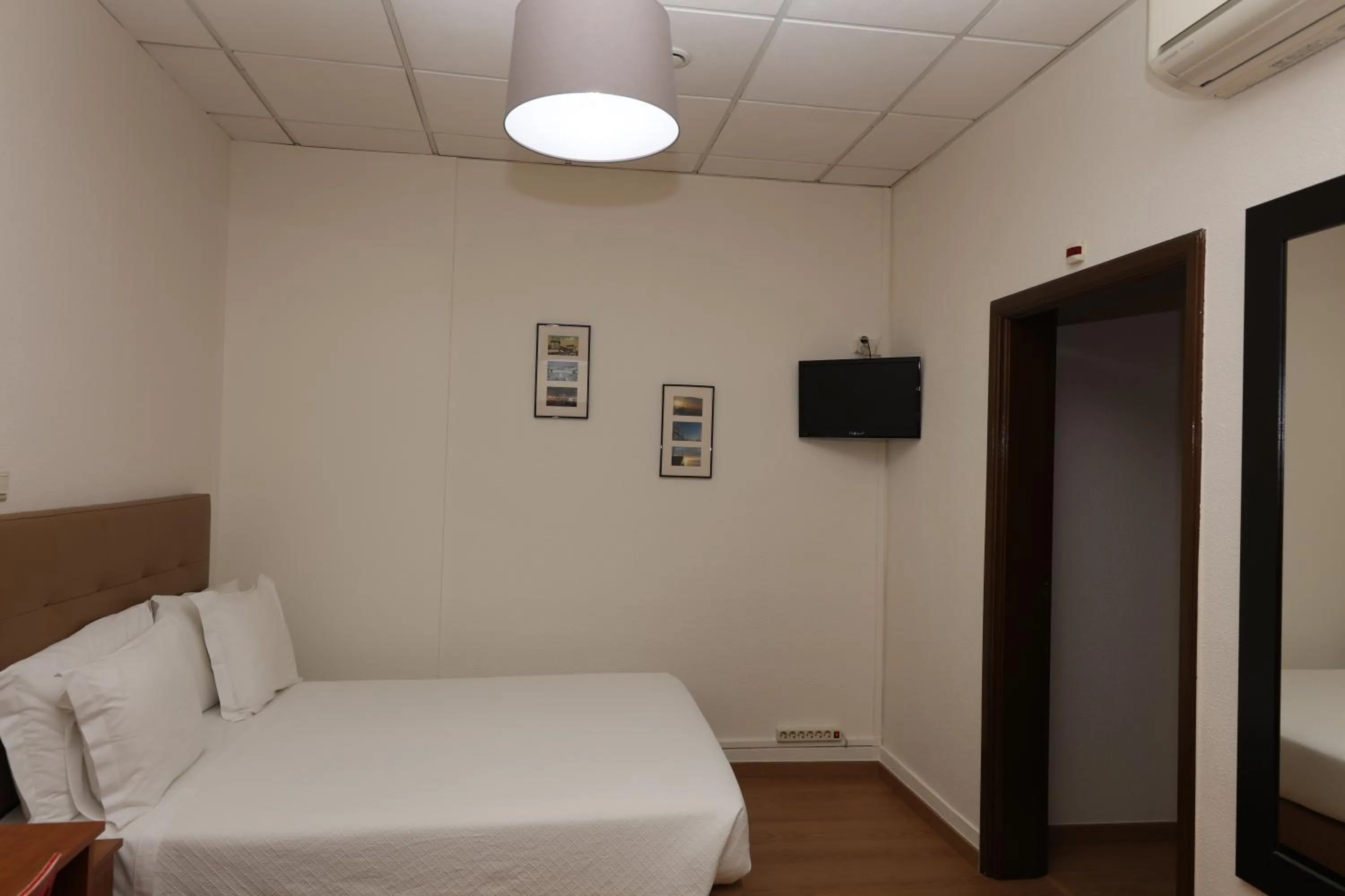 Bed in Pensao Praca Da Figueira