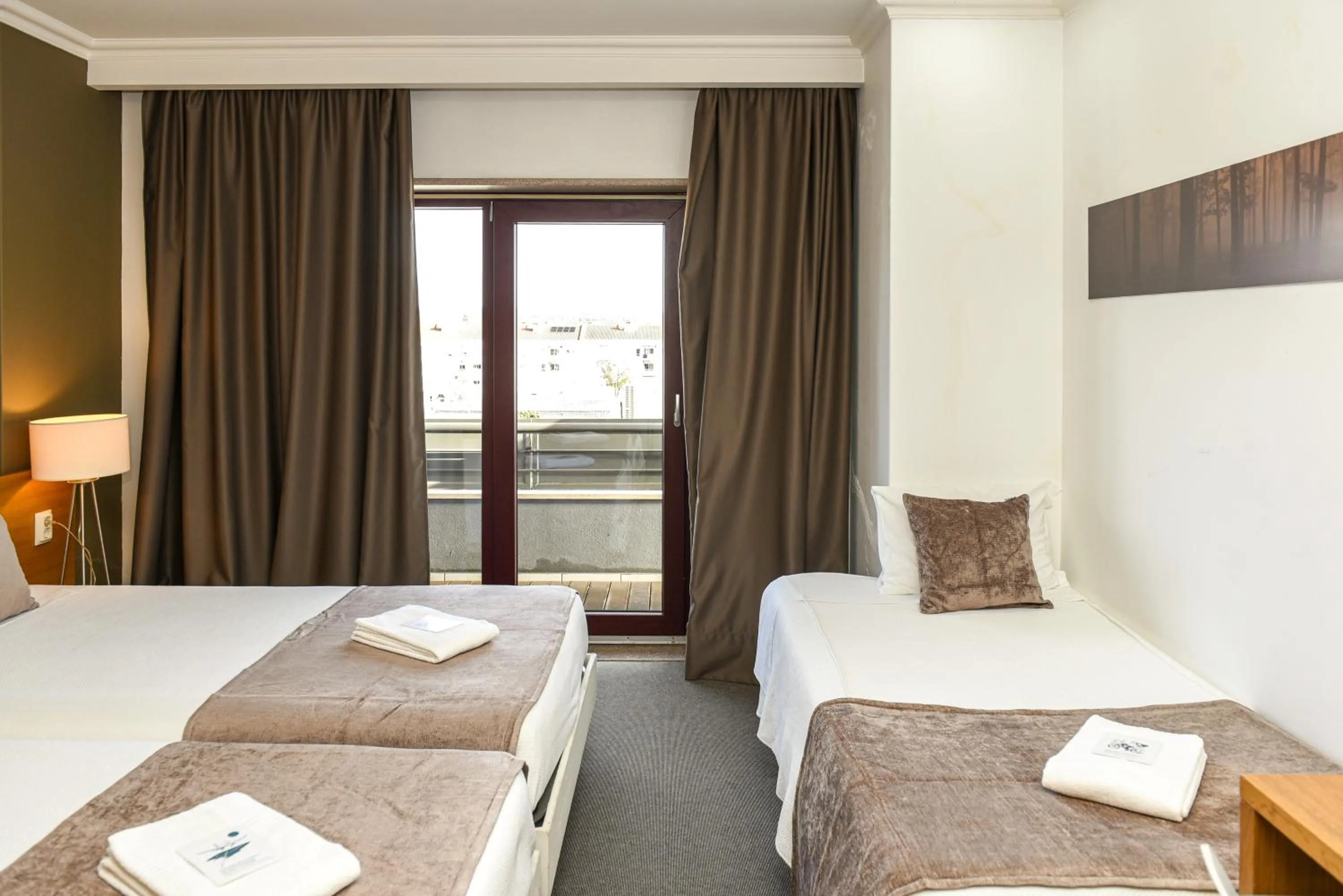 Bed in Dom Joao Hotel