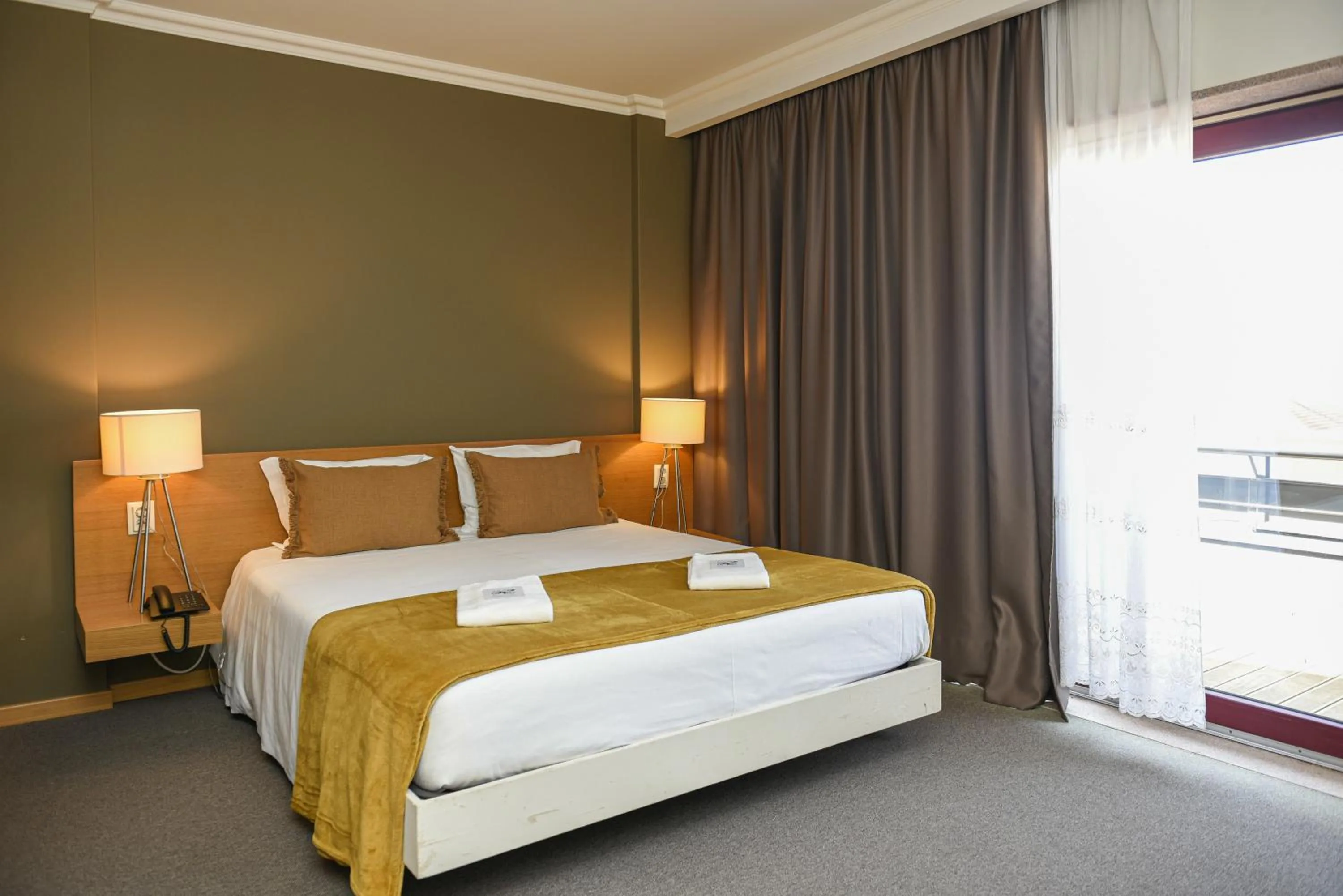 Bed in Dom Joao Hotel