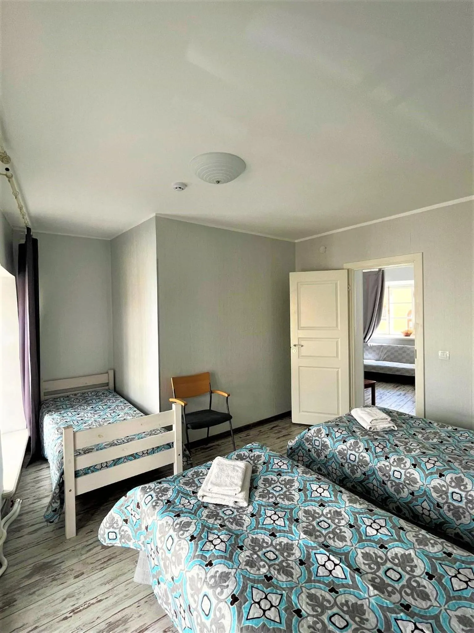 Bed in Godart Rooms Guesthouse