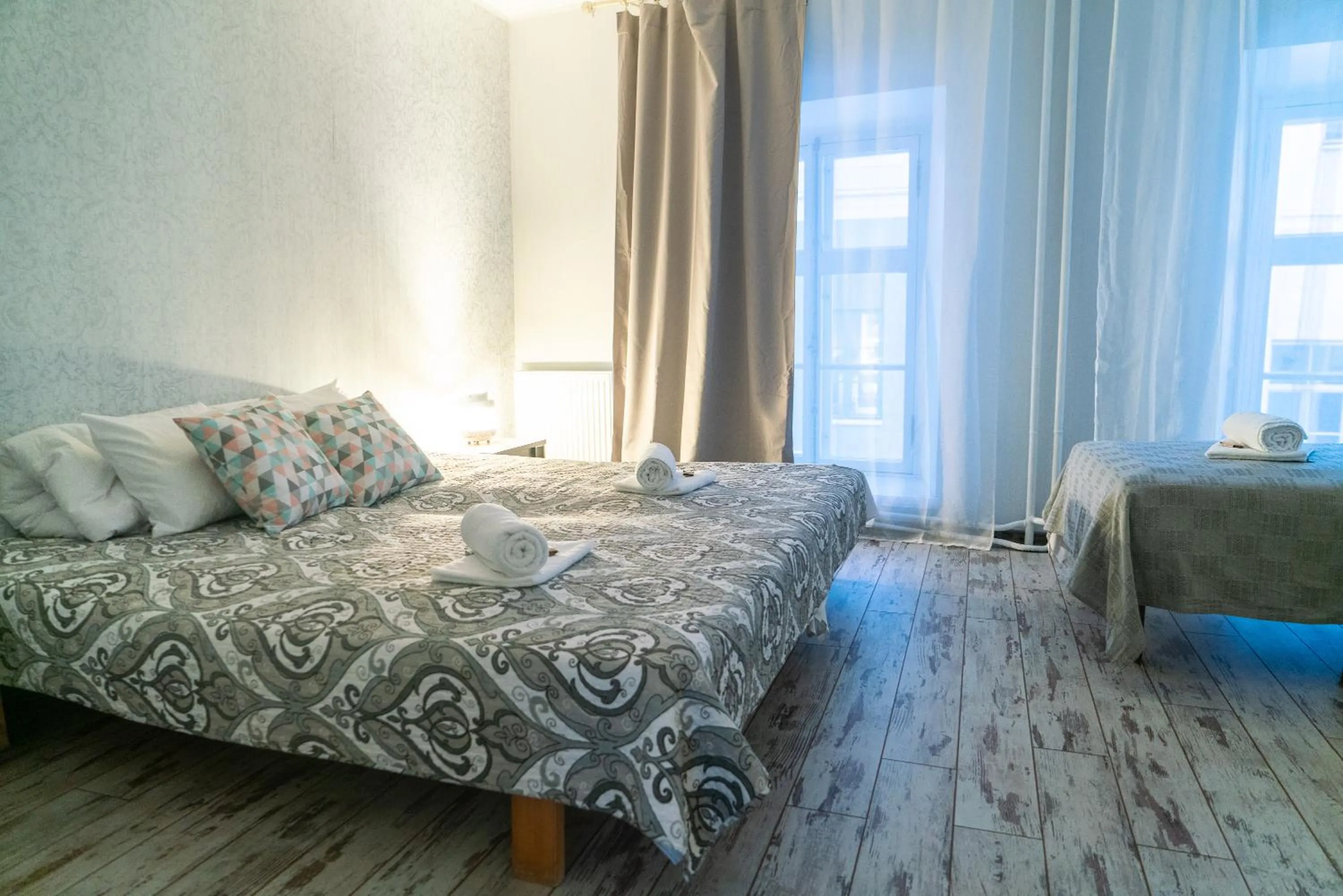 Bed in Godart Rooms Guesthouse