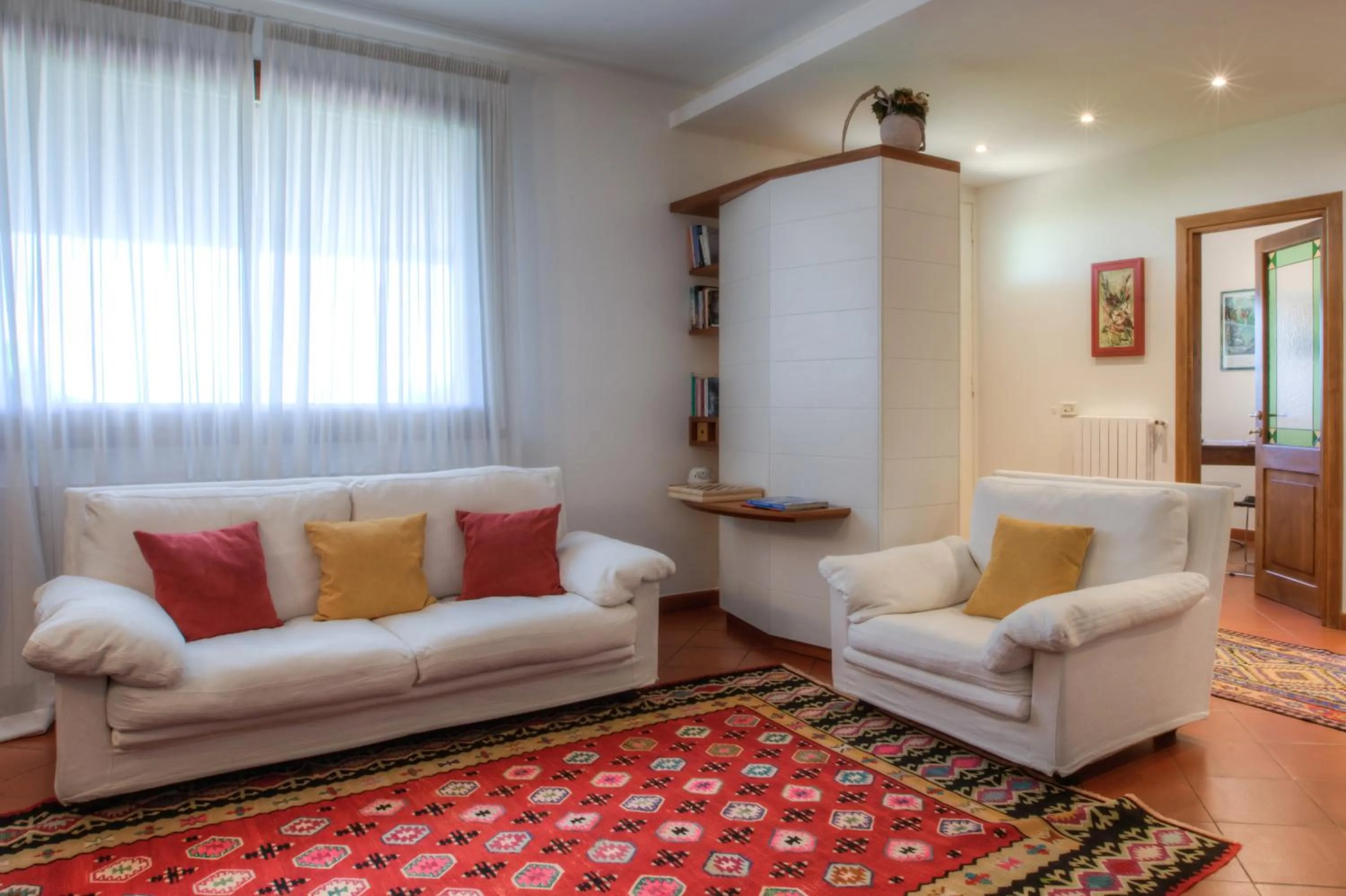 Communal lounge/ TV room in B&B Maison Il Melograno