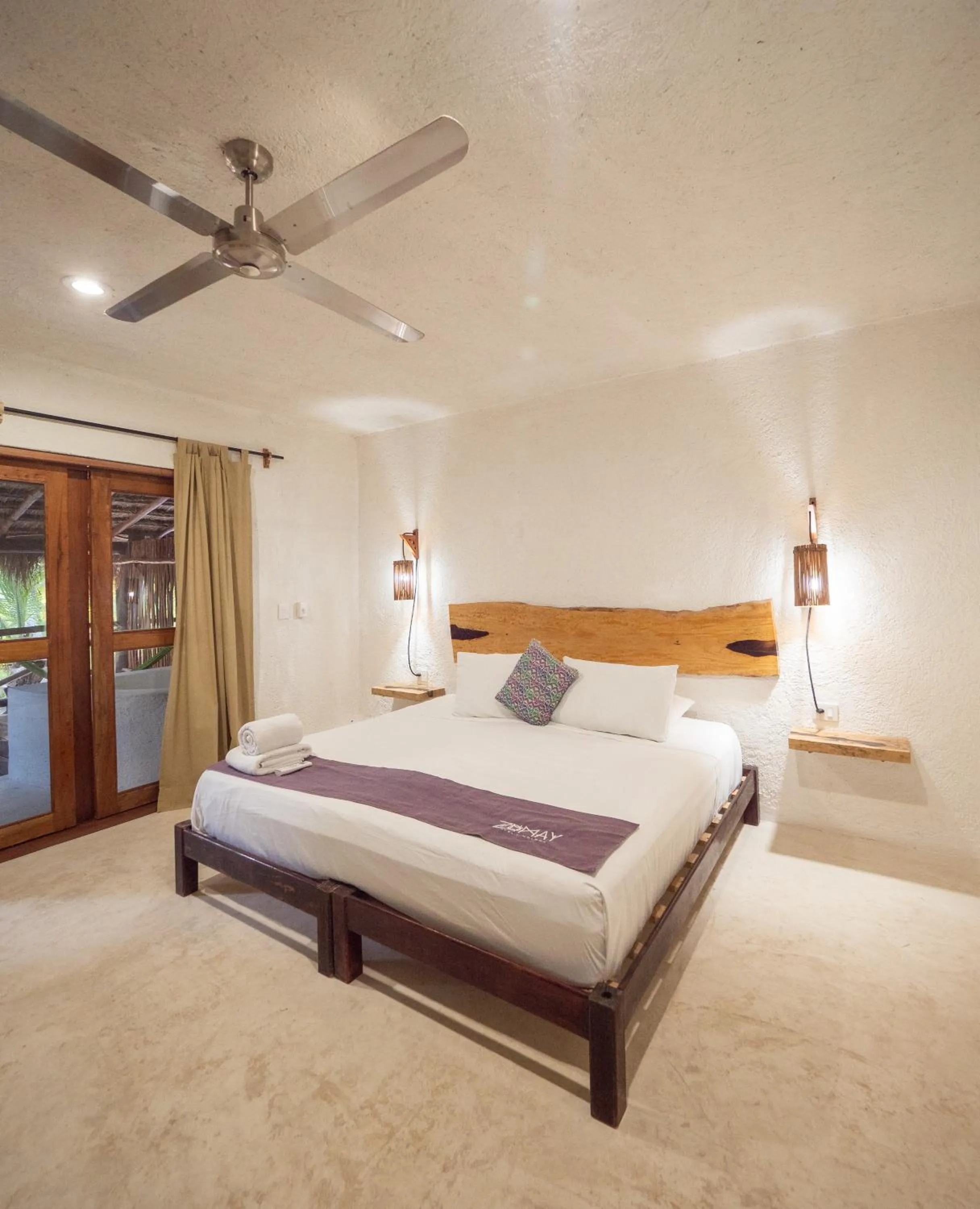 Bed in Zomay Beachfront Holbox