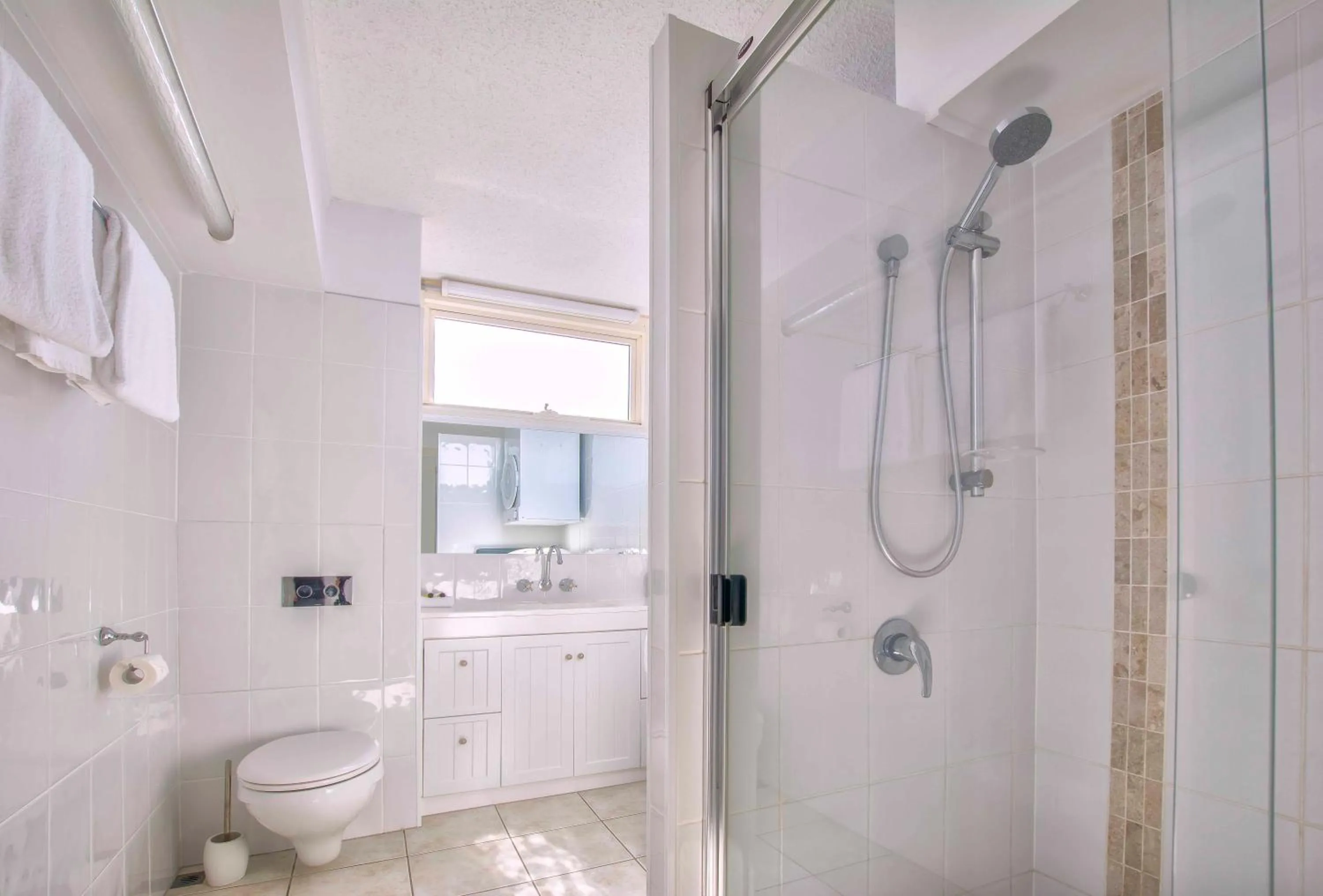 Bathroom in 84 The Spit Holiday Apartments