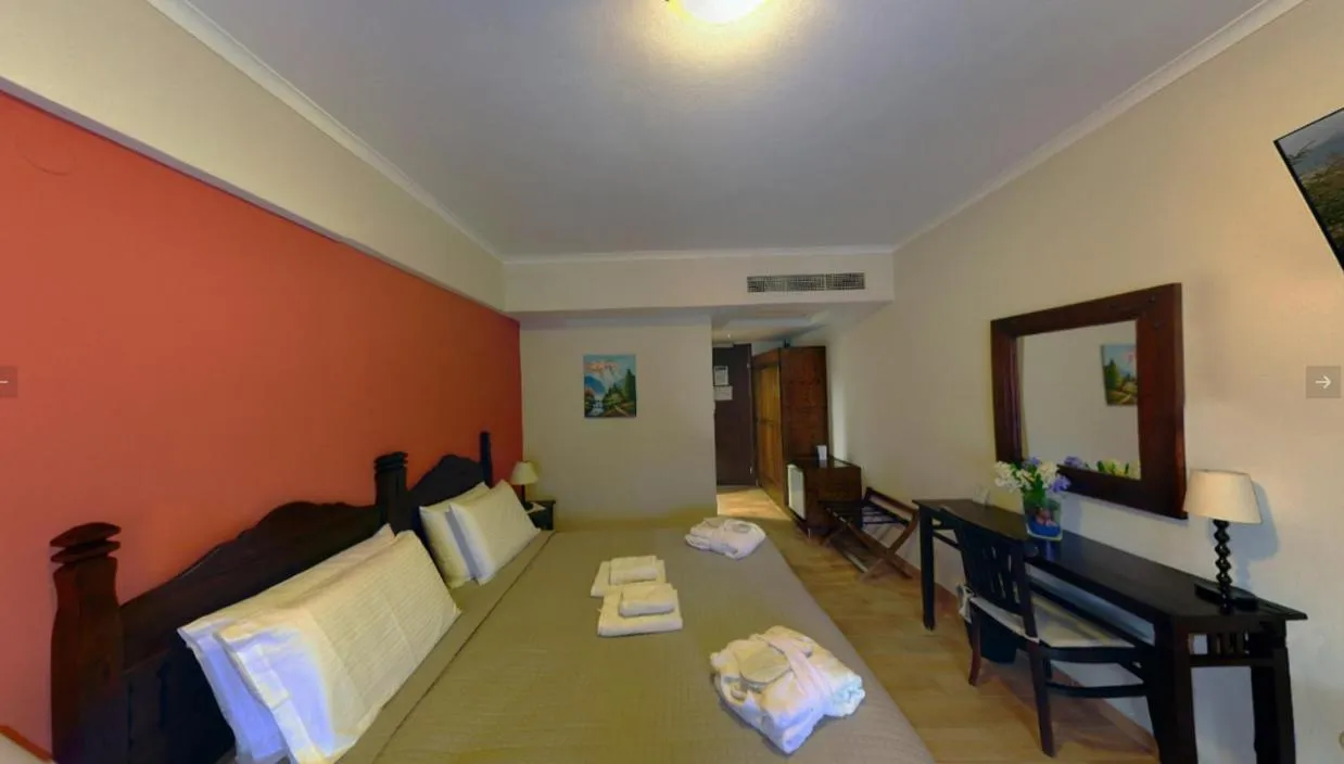 Bed in Melegos Inn Hotel