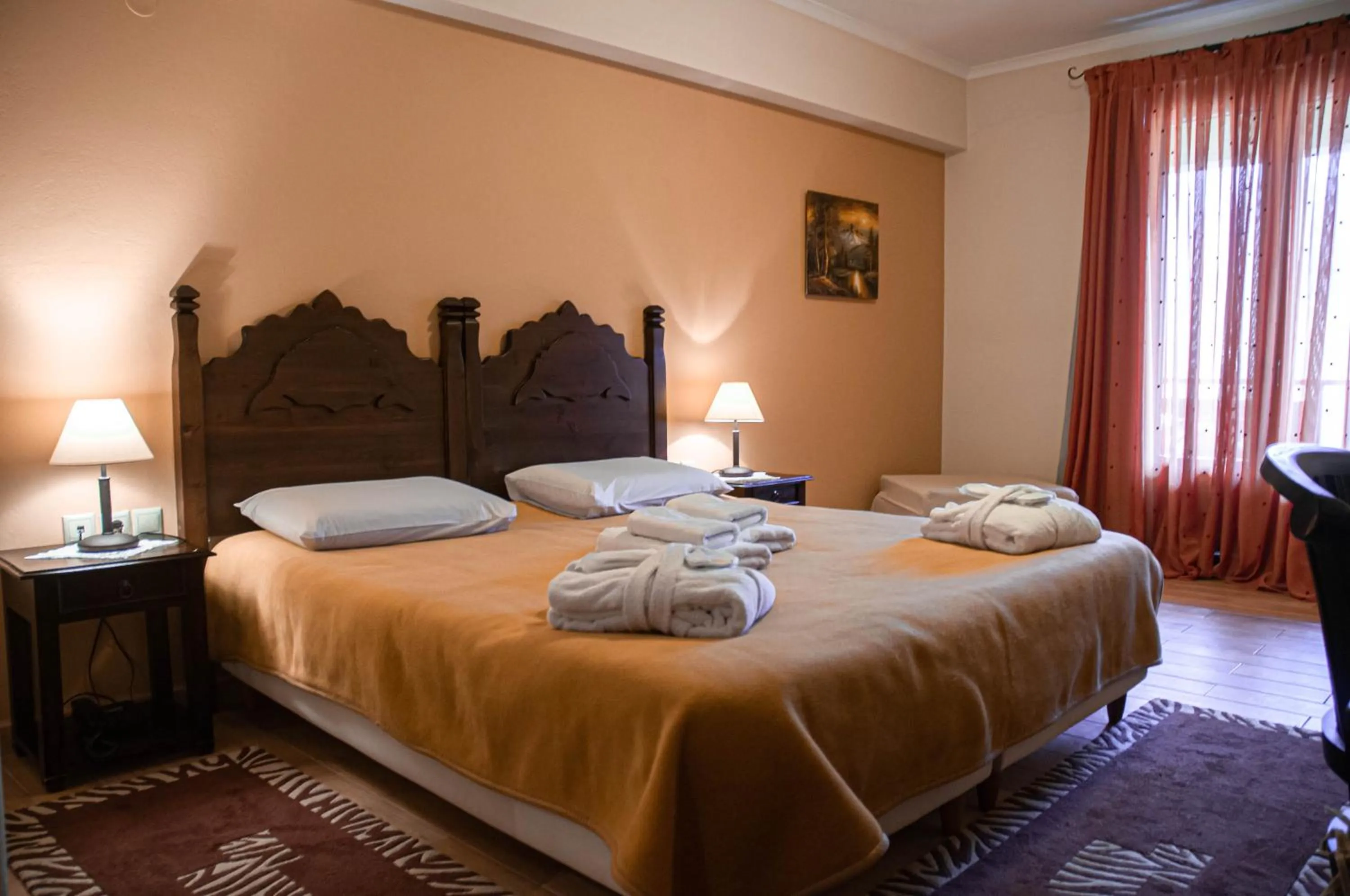 Bed in Melegos Inn Hotel