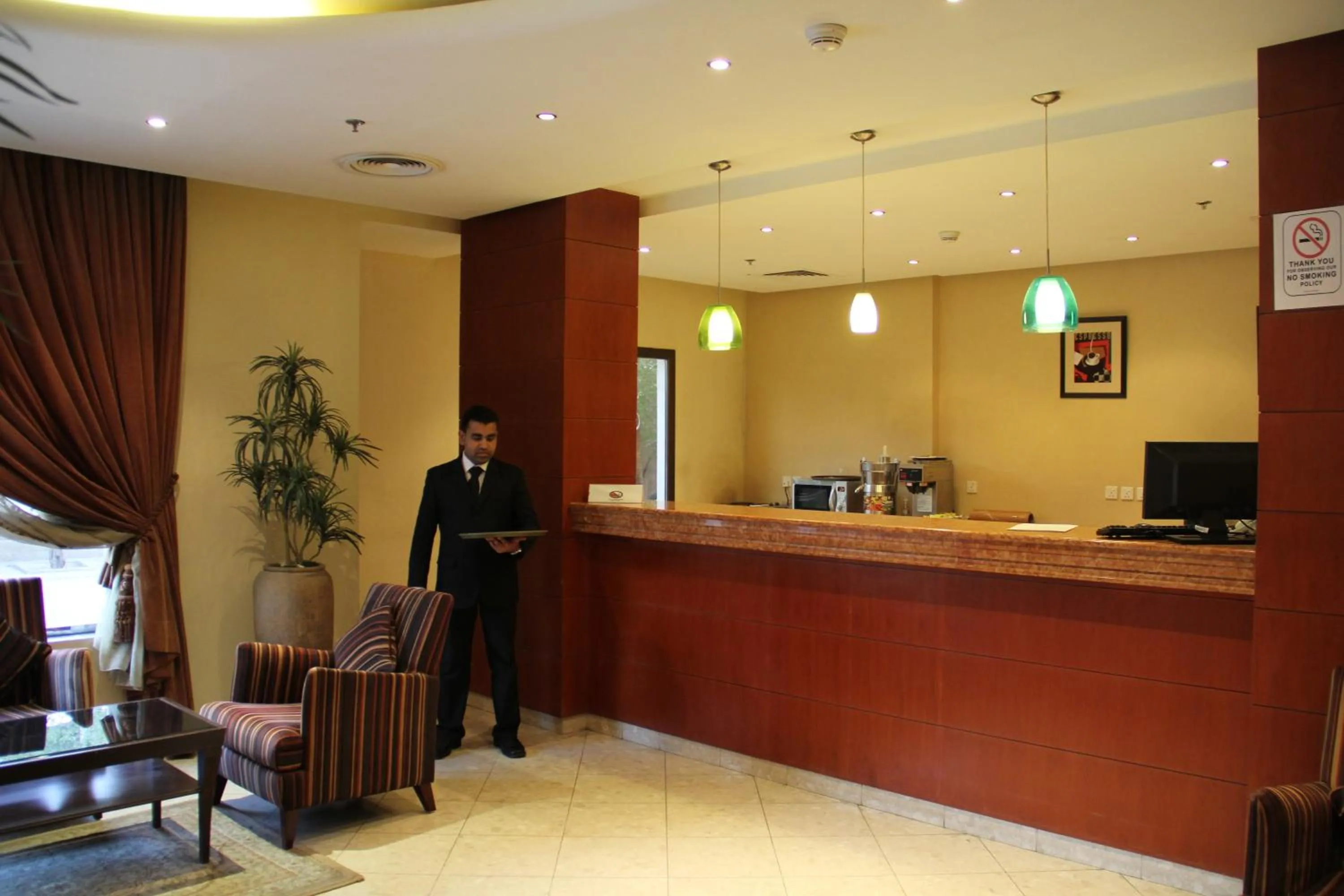 Staff in Reef Al Malaz International Hotel by Al Azmy