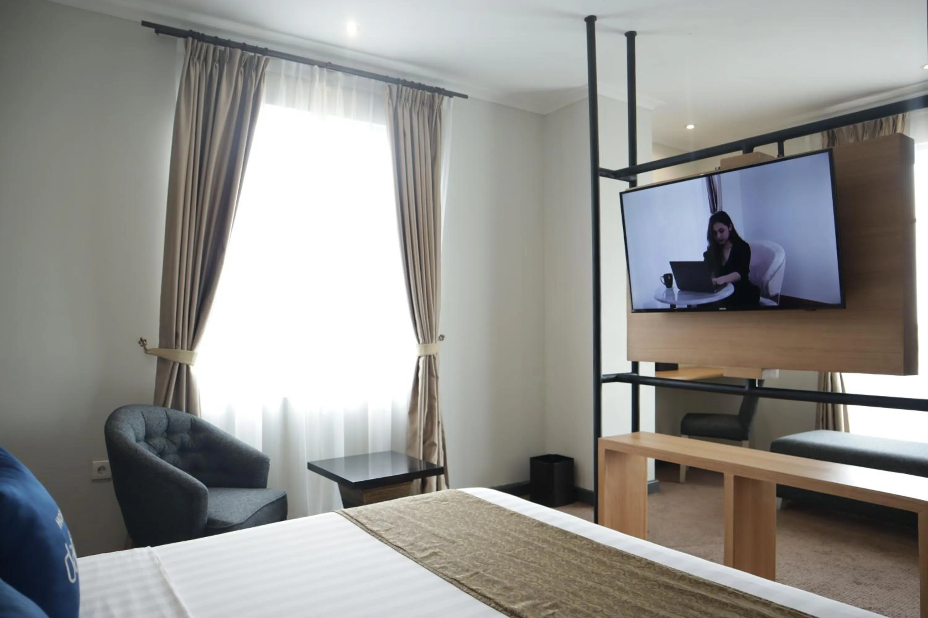 Bed in Hotel Dafam Semarang