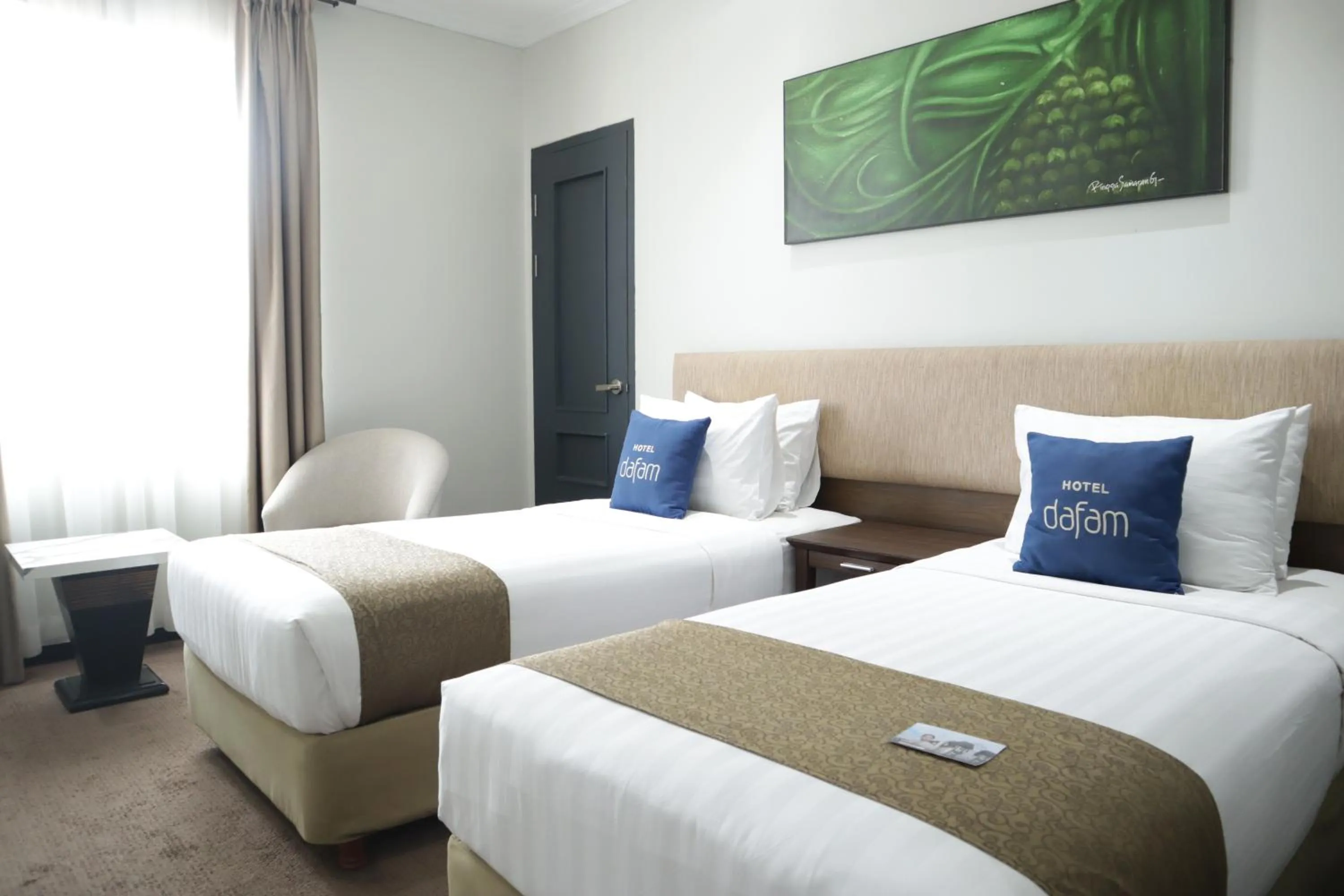 Bed in Hotel Dafam Semarang