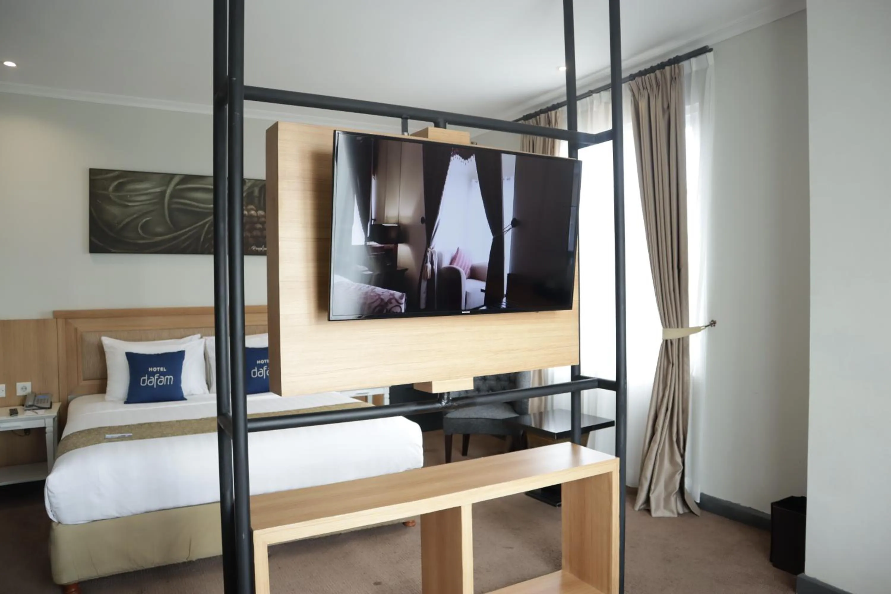 Bed in Hotel Dafam Semarang