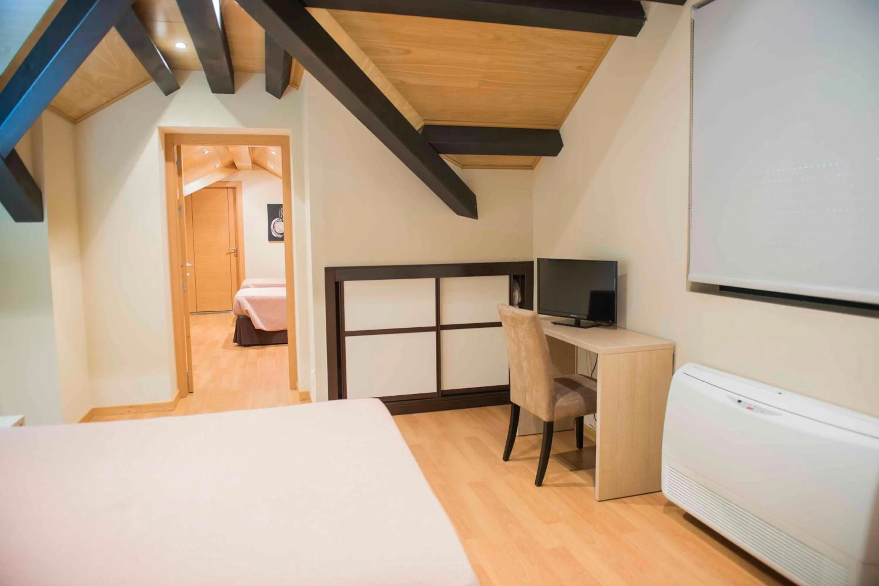 Bed in Hotel Meson de Erosa