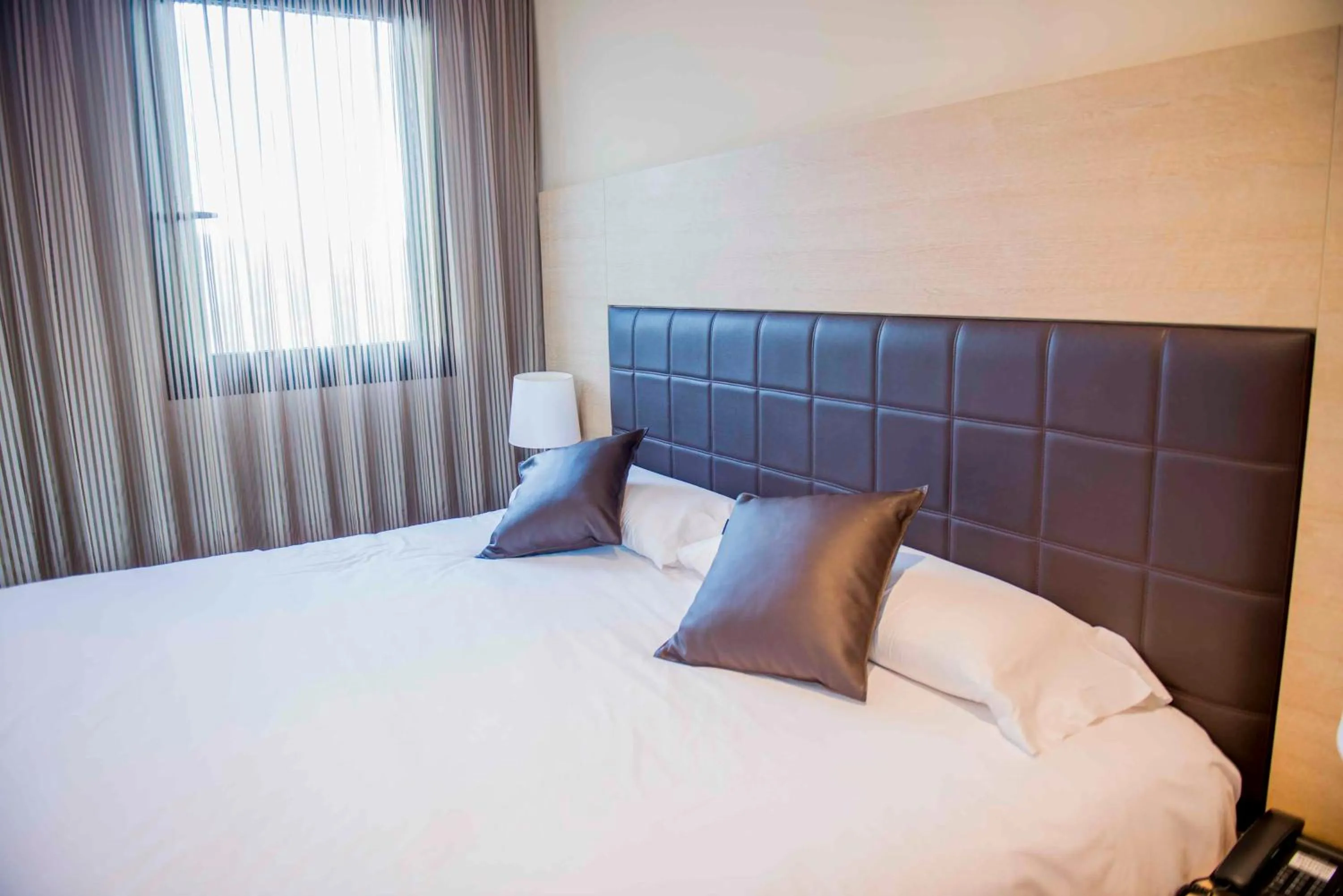 Bed in Hotel Meson de Erosa