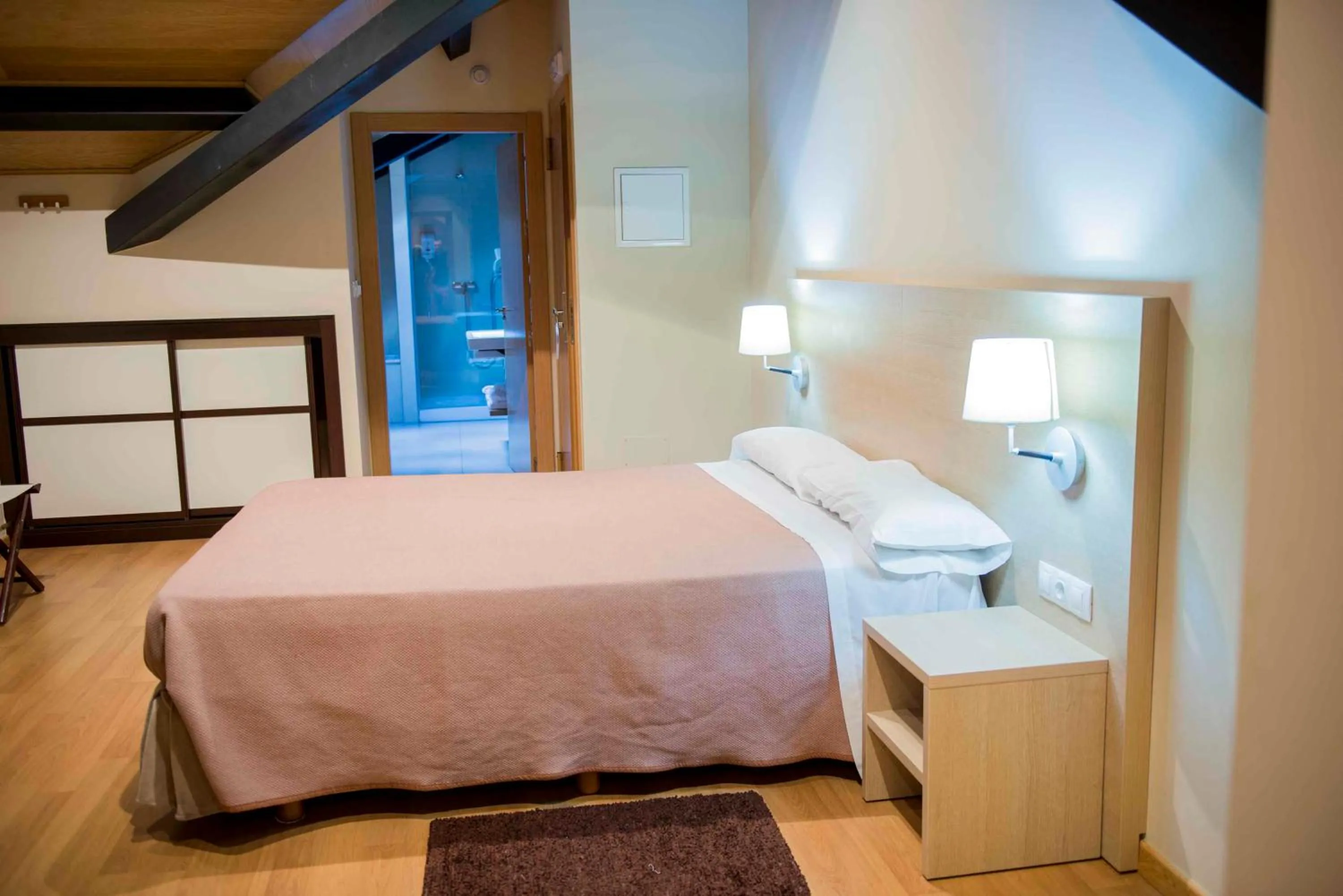 Bed in Hotel Meson de Erosa