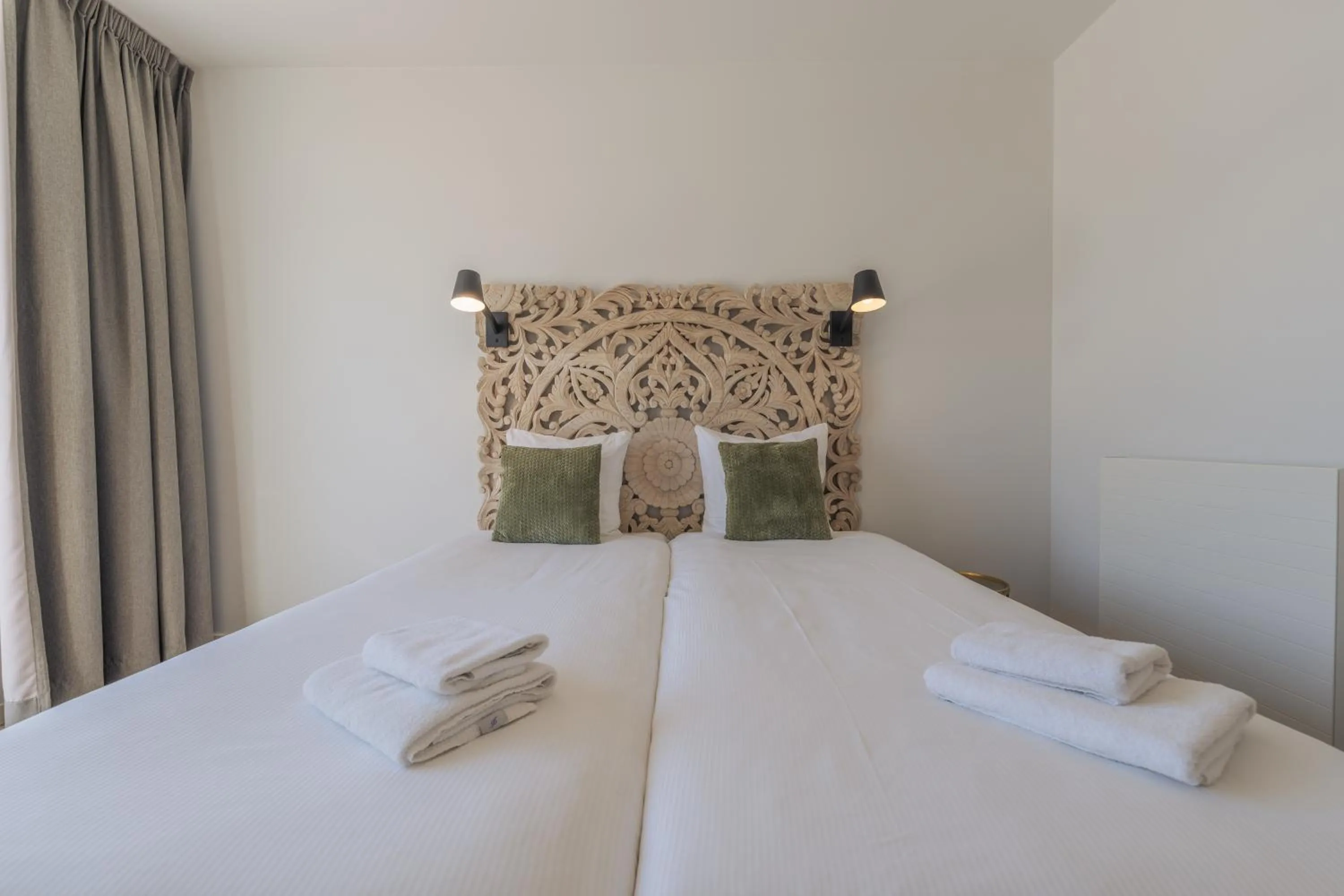 Bed in Strandhotel Dennenbos