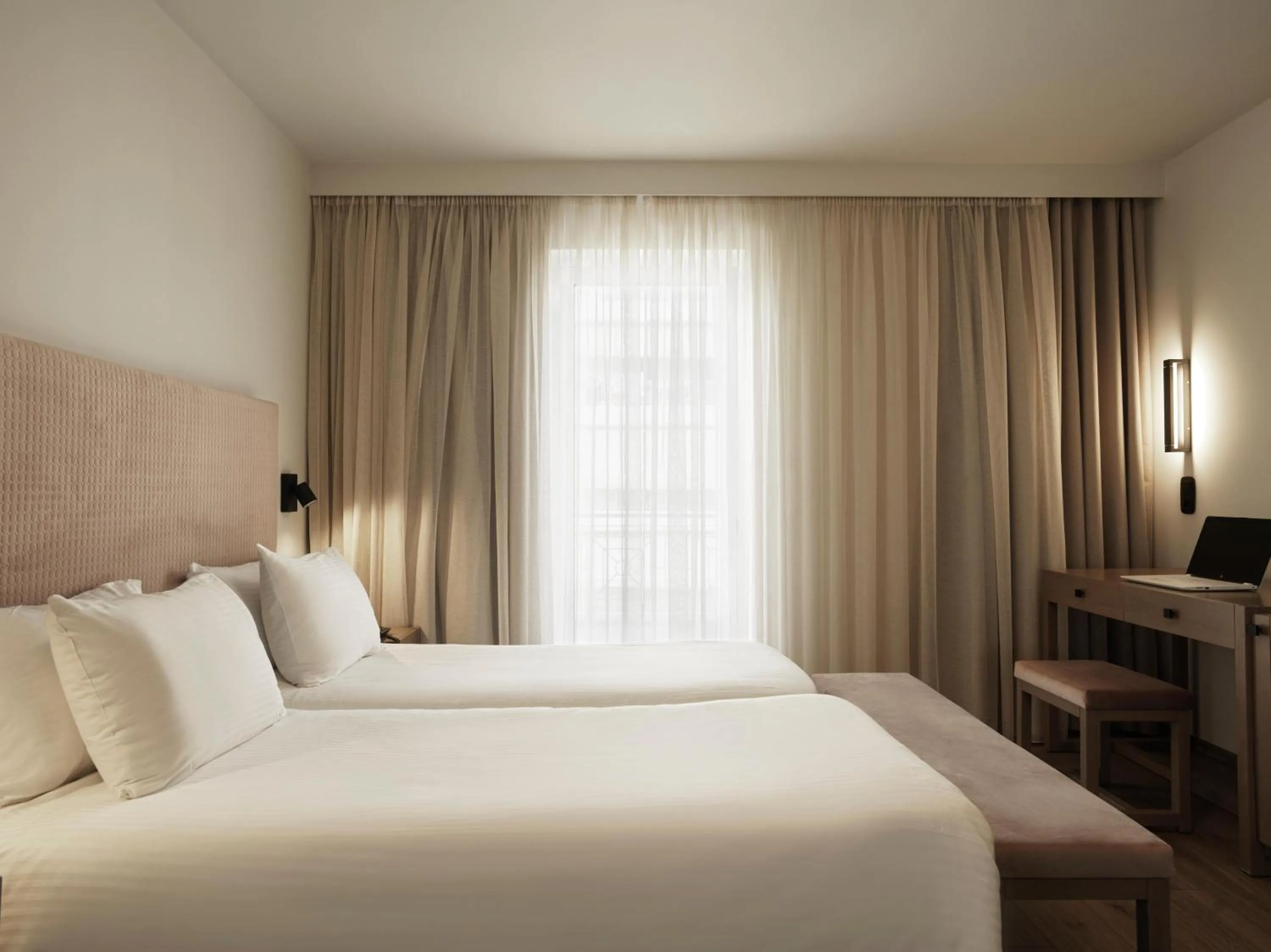 Bed in Civitel Attik Rooms & Suites