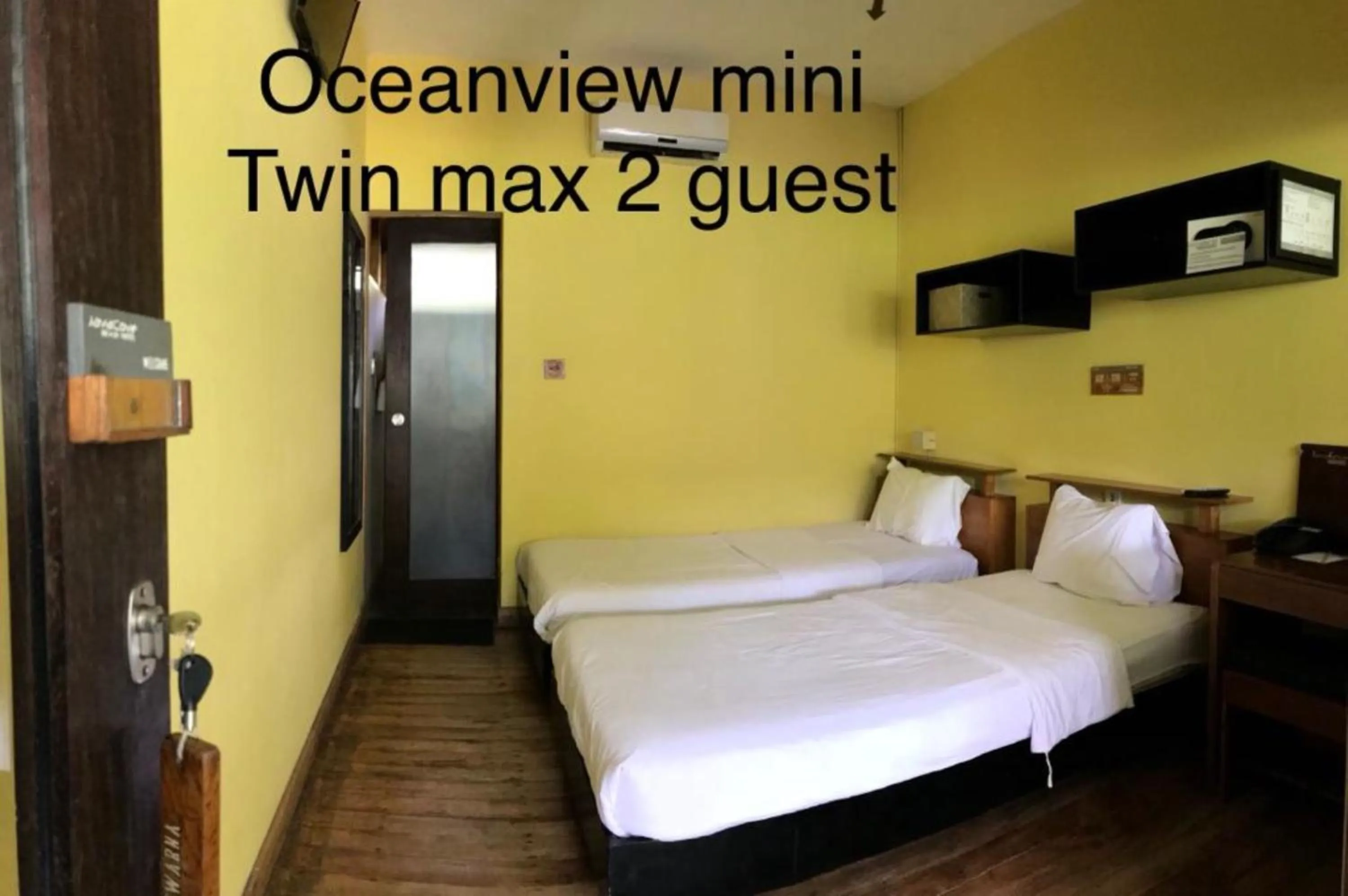 Bed in JavaCove Beach Hotel