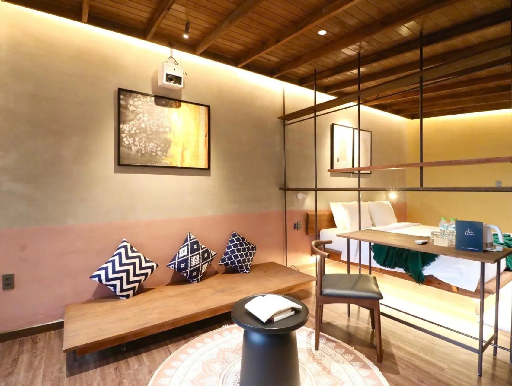 Seating area, Bed in Joi Boutique Bãi Trước