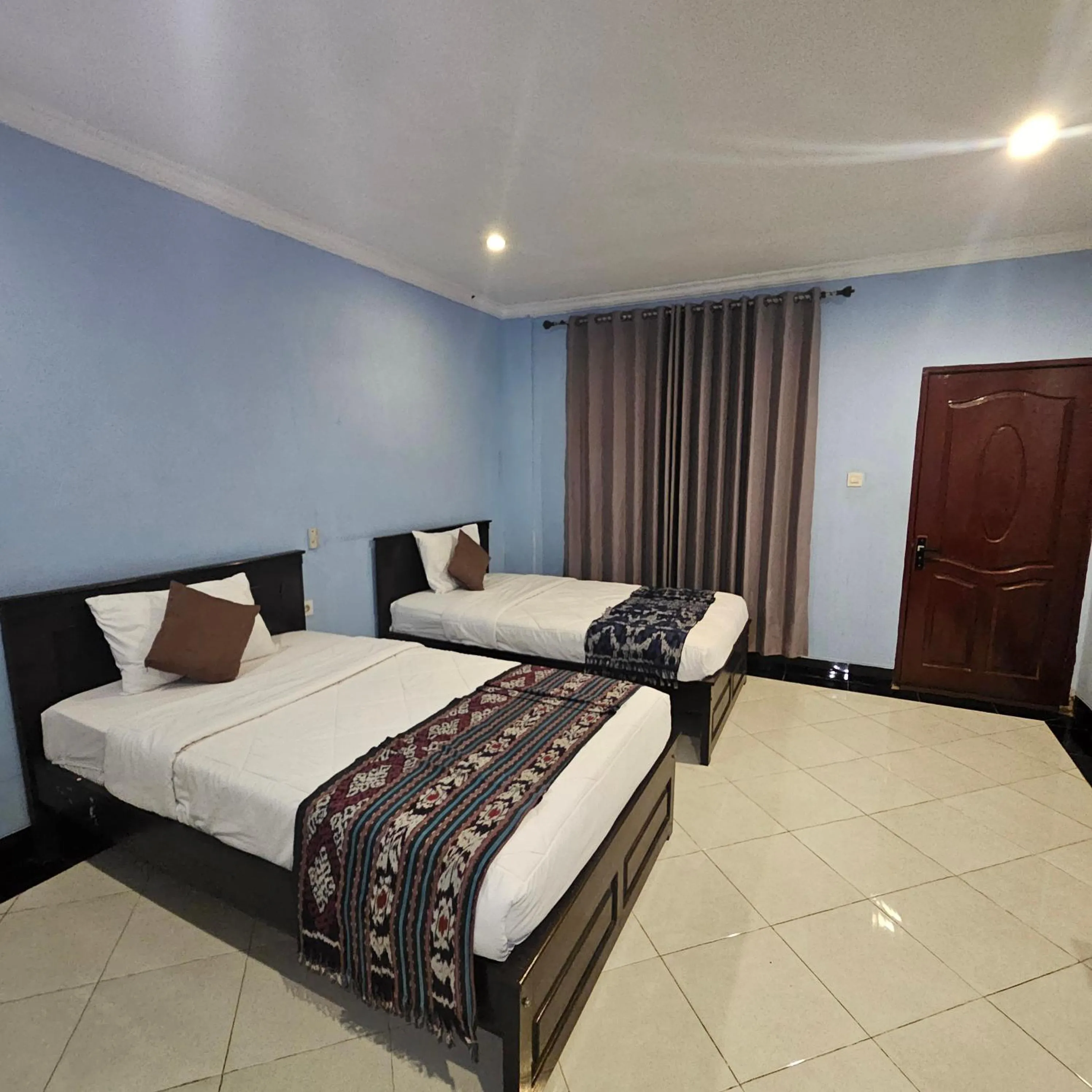 Bed in Ridho Malik Hotel