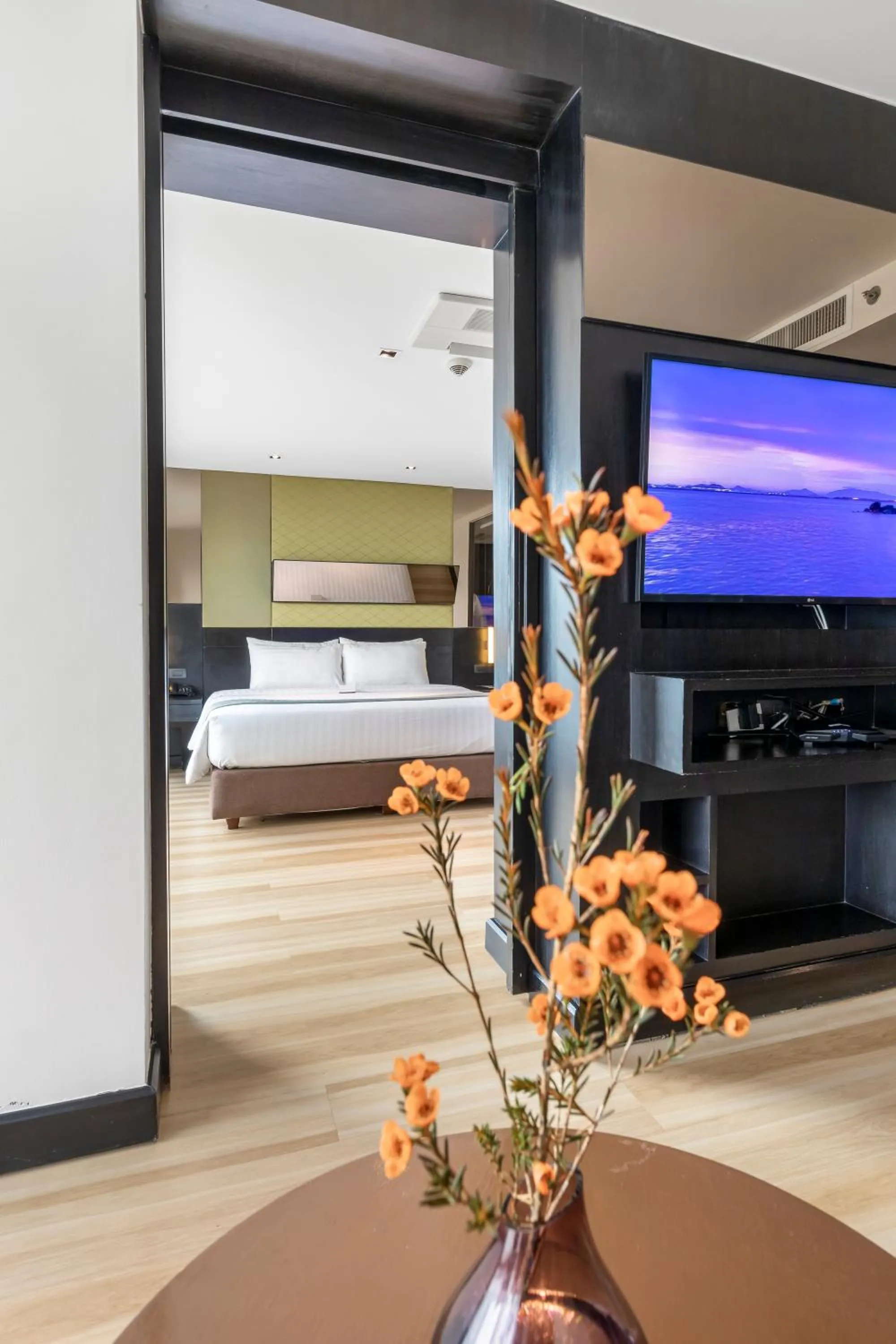 Communal lounge/ TV room, Bed in Golden Tulip Mandison Suites