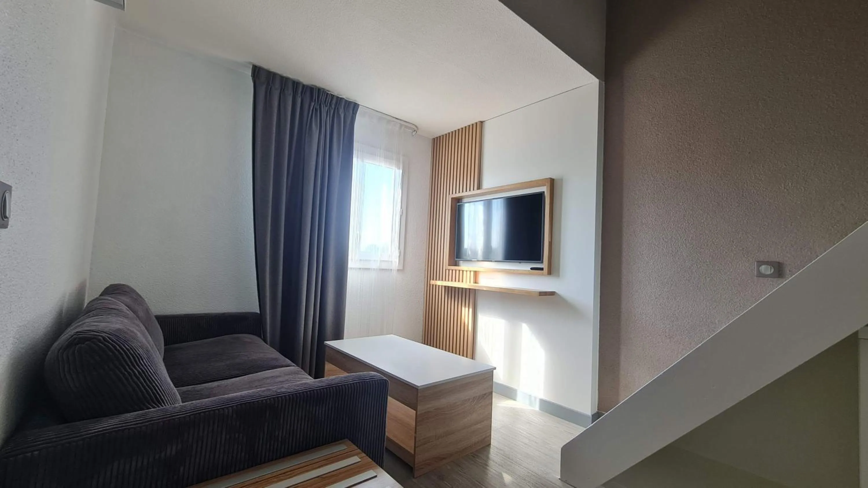 Living room in Kyriad Montpellier Sud - A709