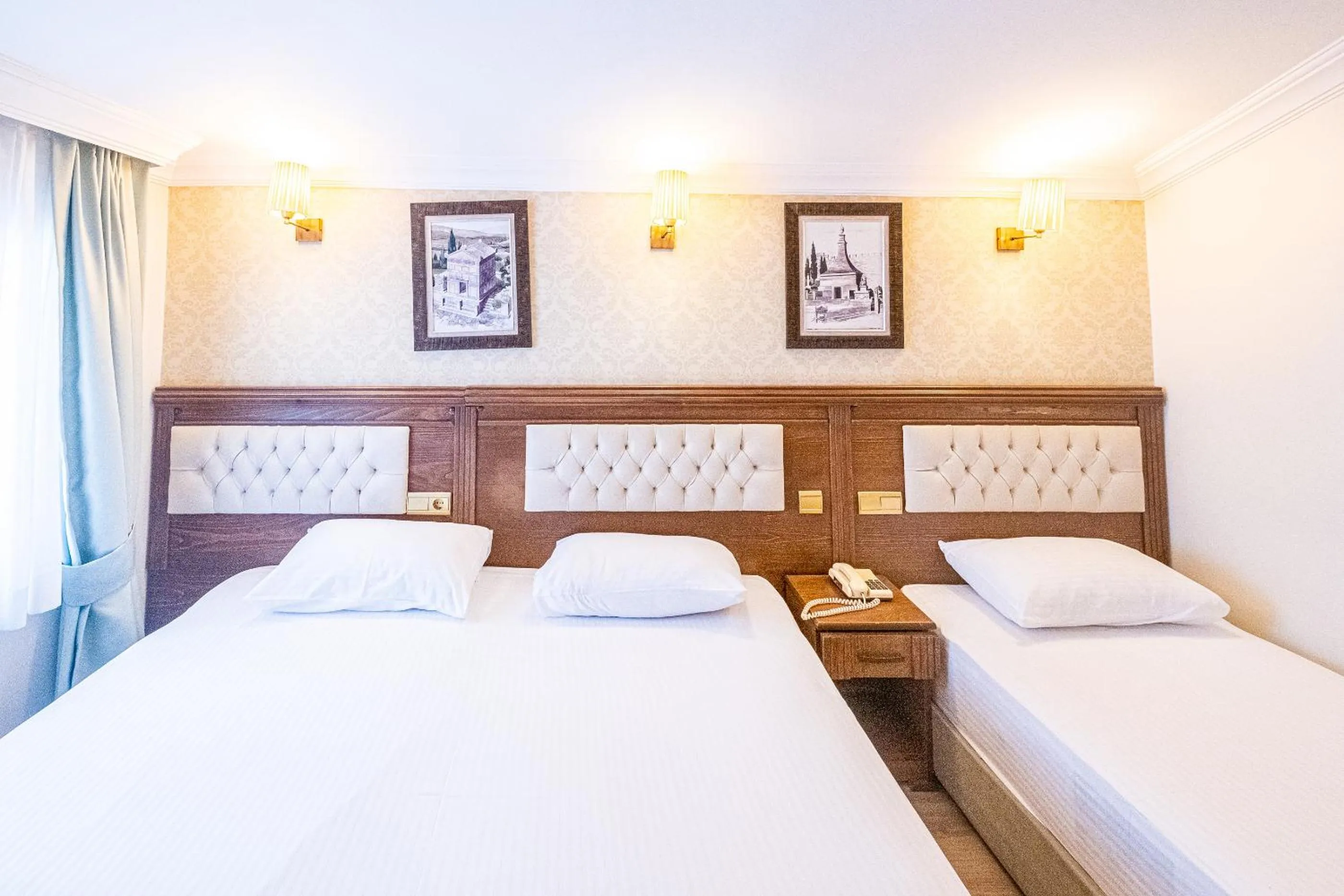 Photo of the whole room, Bed in Assos Kervansaray Hotel - Special Category