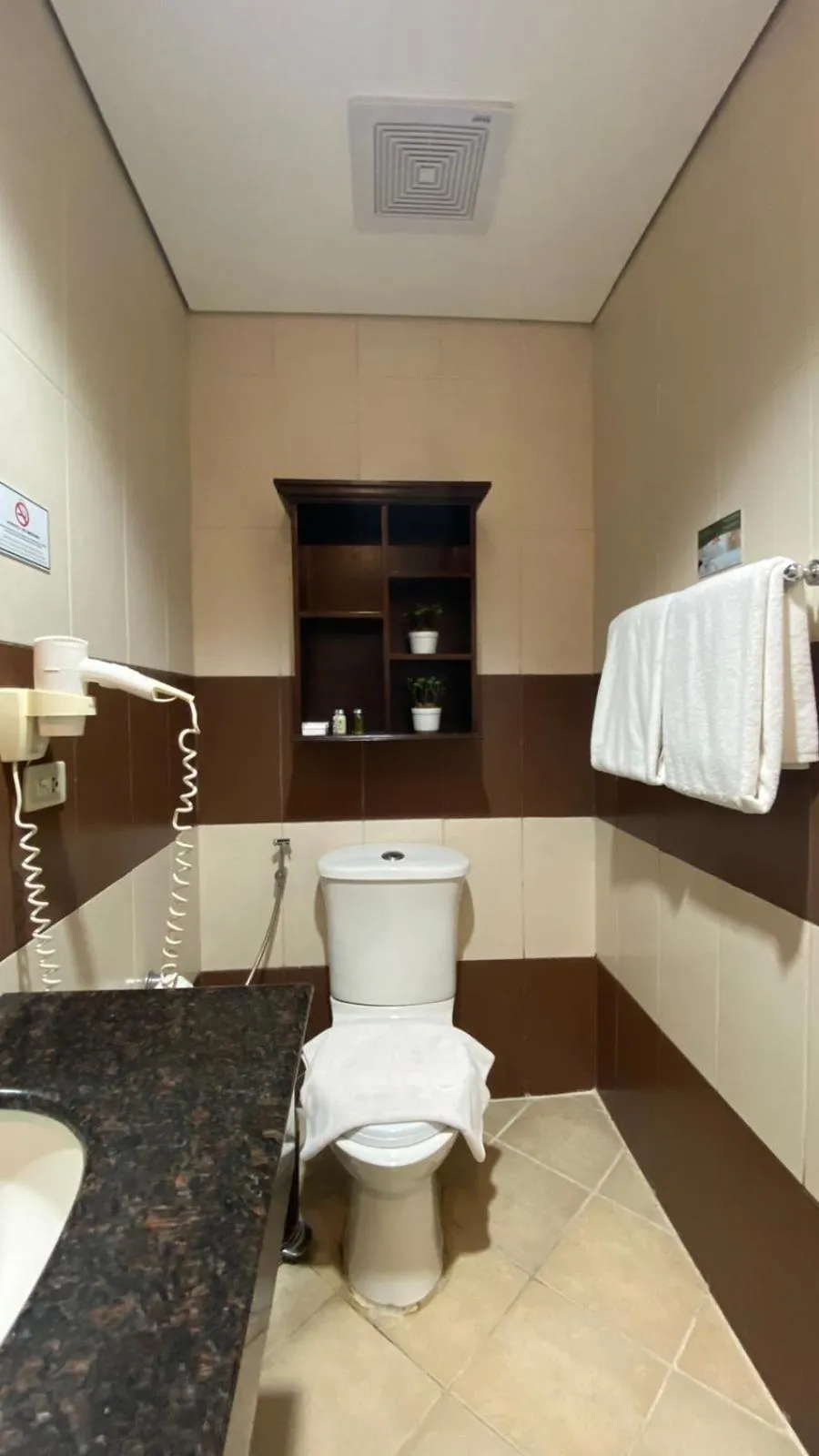 Toilet in Crosswinds Resort Suites