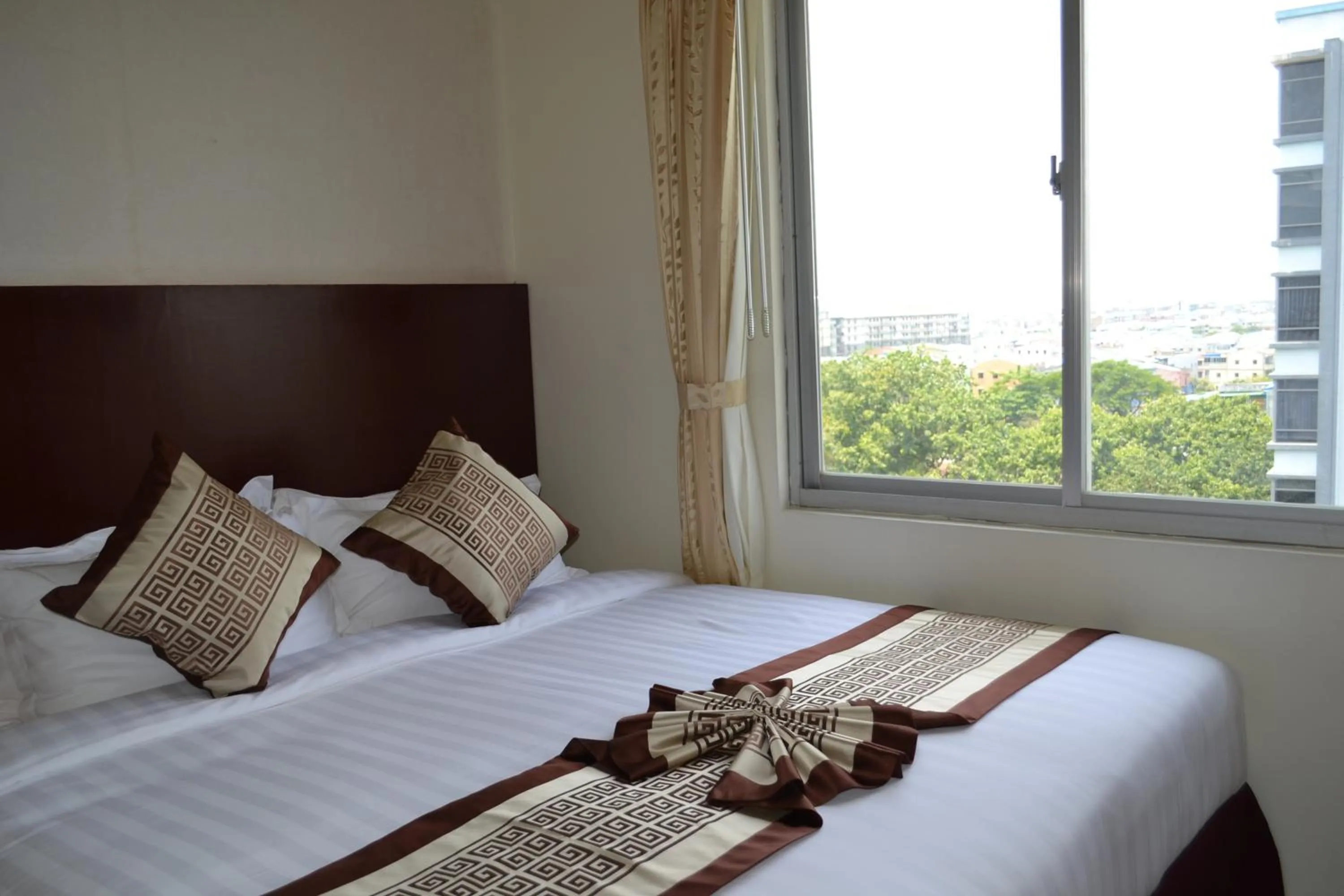 Bed in Hotel Broadway Yangon
