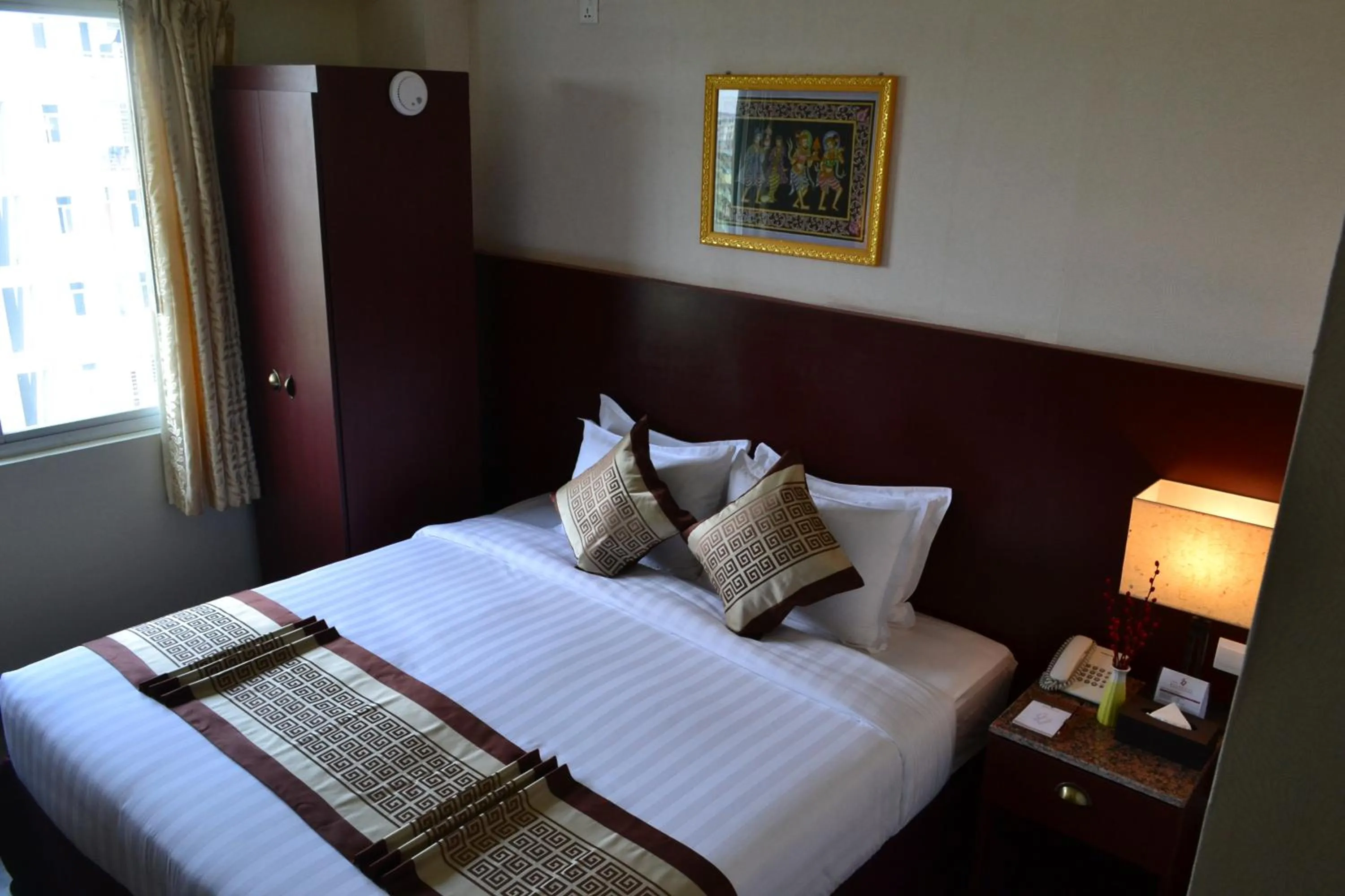 Bed in Hotel Broadway Yangon