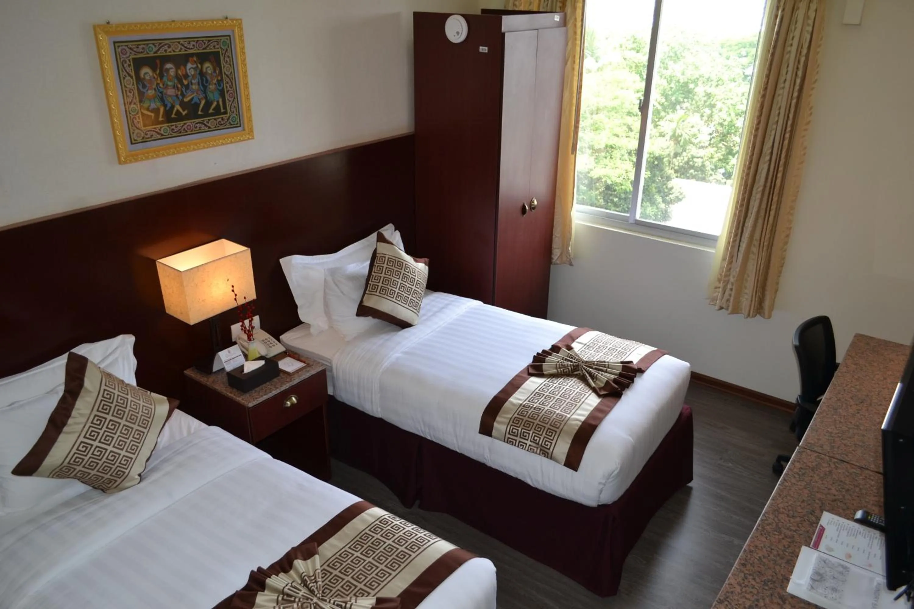 Bed in Hotel Broadway Yangon