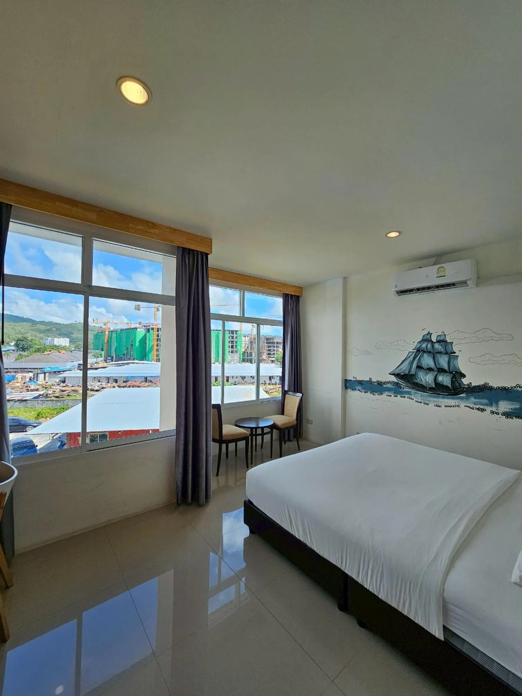 Bed in Dwell Phuket Airport Hotel at Naiyang