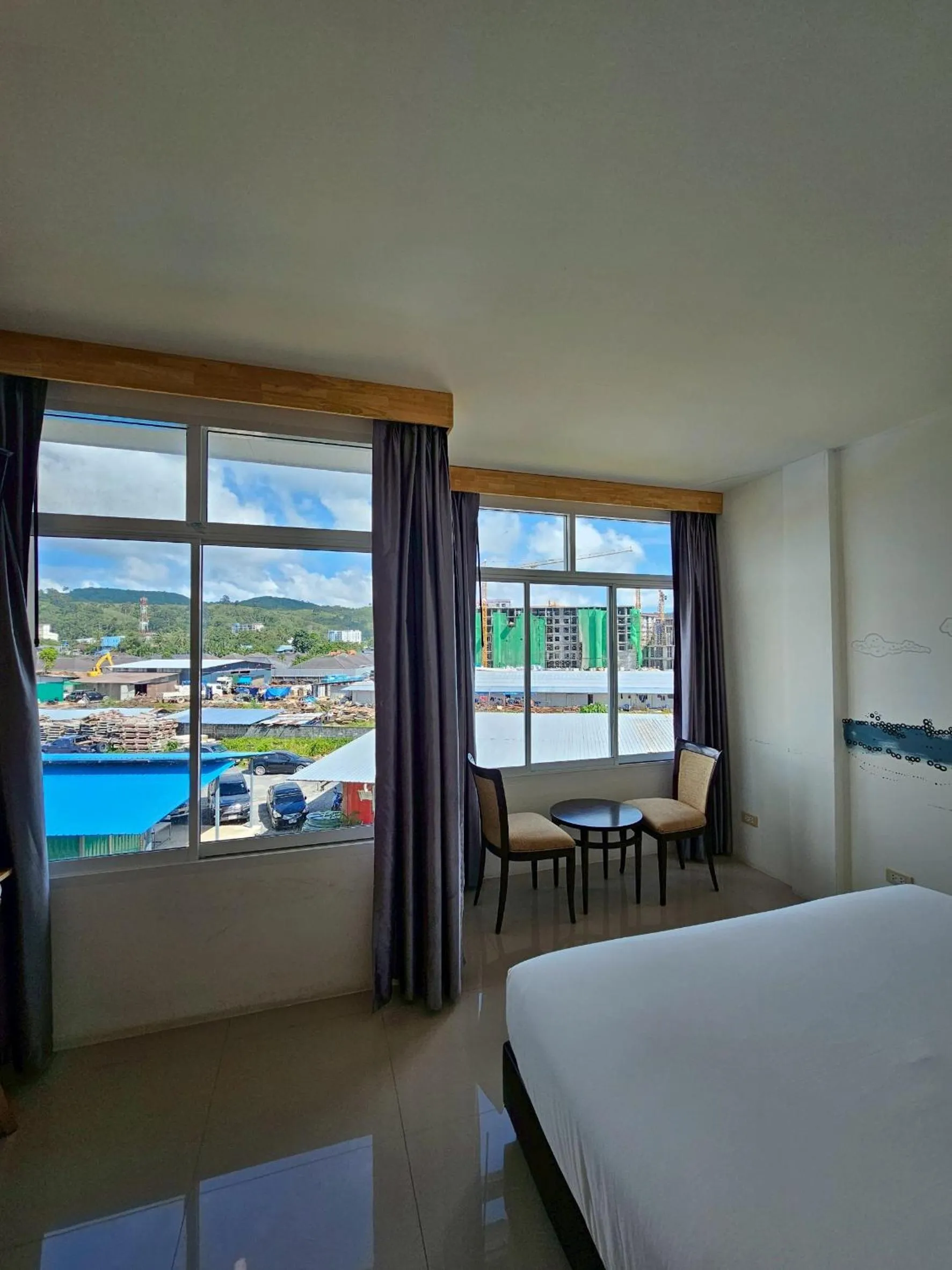 Bed in Dwell Phuket Airport Hotel at Naiyang